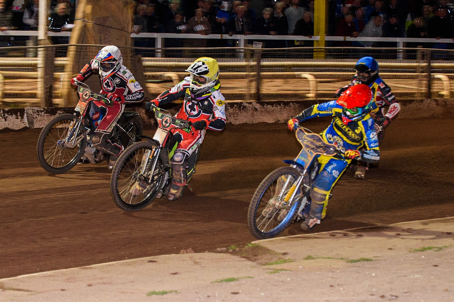 SHEFFIELD, UK. AUG 2NDKyle Howarth  (Red) inside Tom Brennan  (Yellow) and Steve Worrall  (White) with Nathan Greaves  (Blue) behind during the SGB Premiership match between Sheffield Tigers and Belle Vue Aces at Owlerton Stadium, Sheffield on Thursday 2nd September 2021. (Credit: Ian Charles | MI News)