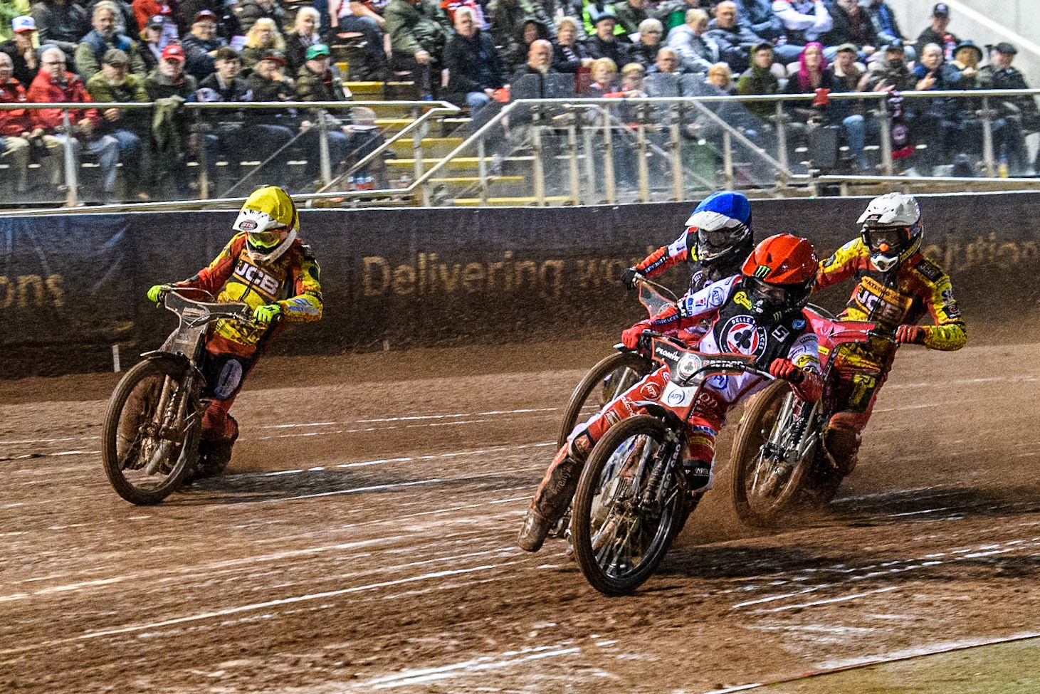 Belle Vue Aces' Dan Bewley  in Red leading Leicester Lions' Max Fricke  in White, Belle Vue Aces' Antti Vuolas  in Blue and Leicester Lions' Richard Lawson  in Yellow during the Rowe Motor Oil Premiership Grand Final 1st Leg between Belle Vue Aces and Leicester Lions at the National Speedway Stadium, Manchester on Monday 23rd September 2024. (Photo: Ian Charles | MI News)