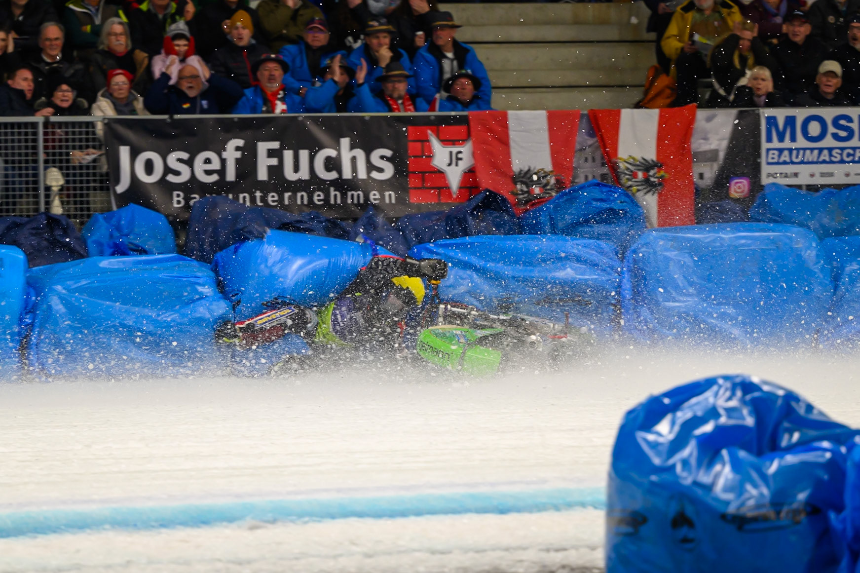 Johann Weber (33) of Germany  spins off behind Heikki Huusko (67) of Finland in Blue during the Ice Speedway Gladiators World Championship Final 1 at Max-Aicher-Arena, Inzell on Saturday 14th March 2026. (Photo: Ian Charles | MI News)