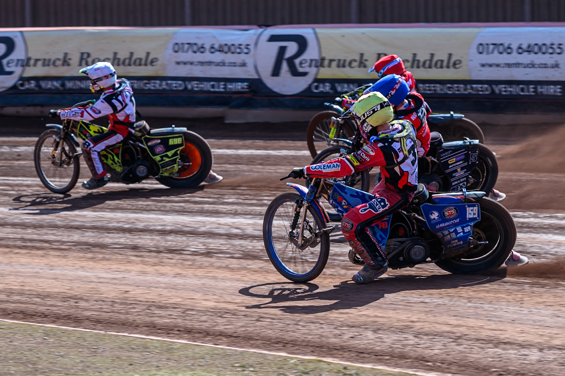 Stene Pijper of Middlesborough Tigers  in Yellow chases Freddy Hodder of Belle Vue Colts  in Blue, William Cairns of Belle Vue Colts  in Red and Ace Pijper of Middlesborough Tigers in White during the WSRA National Development League match between Belle Vue Colts and Middlesbrough Tigers at the National Speedway Stadium, Manchester on Sunday 10th August 2025. (Photo: Mark Fletcher | MI News)
