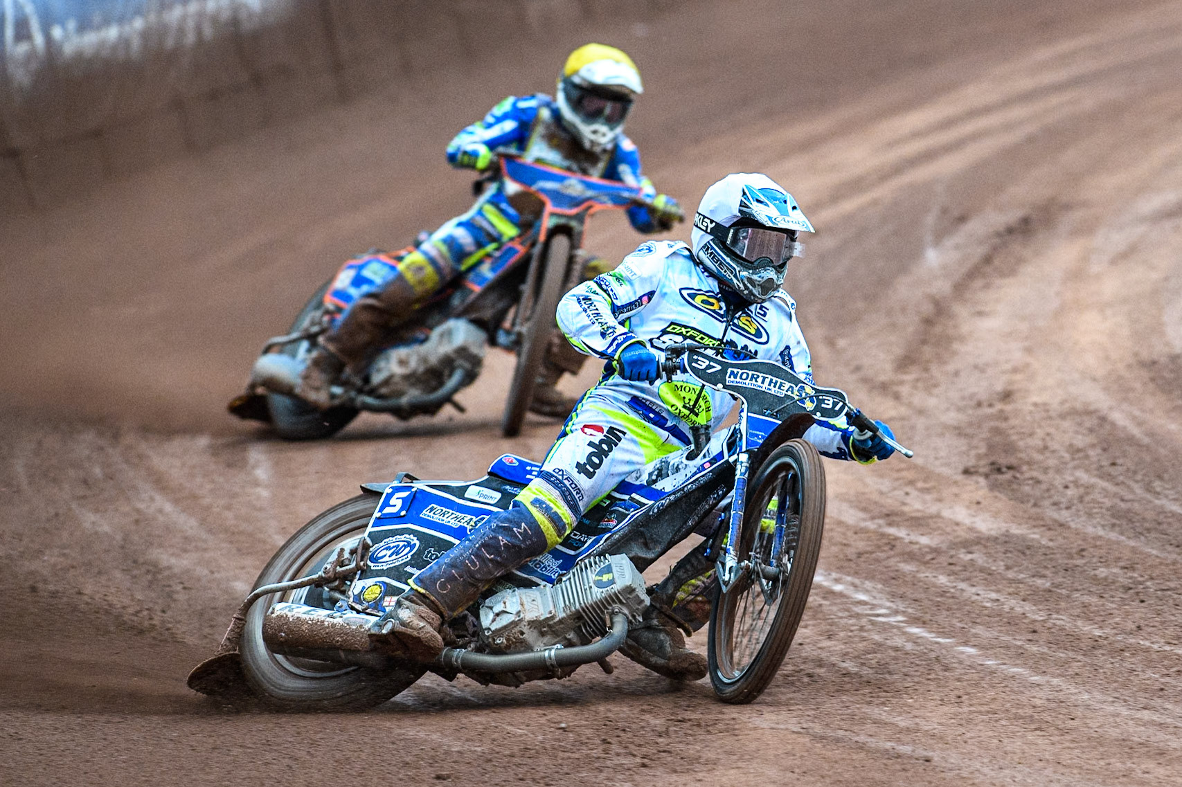 Oxford Spires' Chris Harris   in Yellow leading team mate Luke Killeen  in Yellow during the Rowe Motor Oil Premiership match between Belle Vue Aces and Oxford Spires at the National Speedway Stadium, Manchester on Monday 22nd July 2024. (Photo: Ian Charles | MI News)