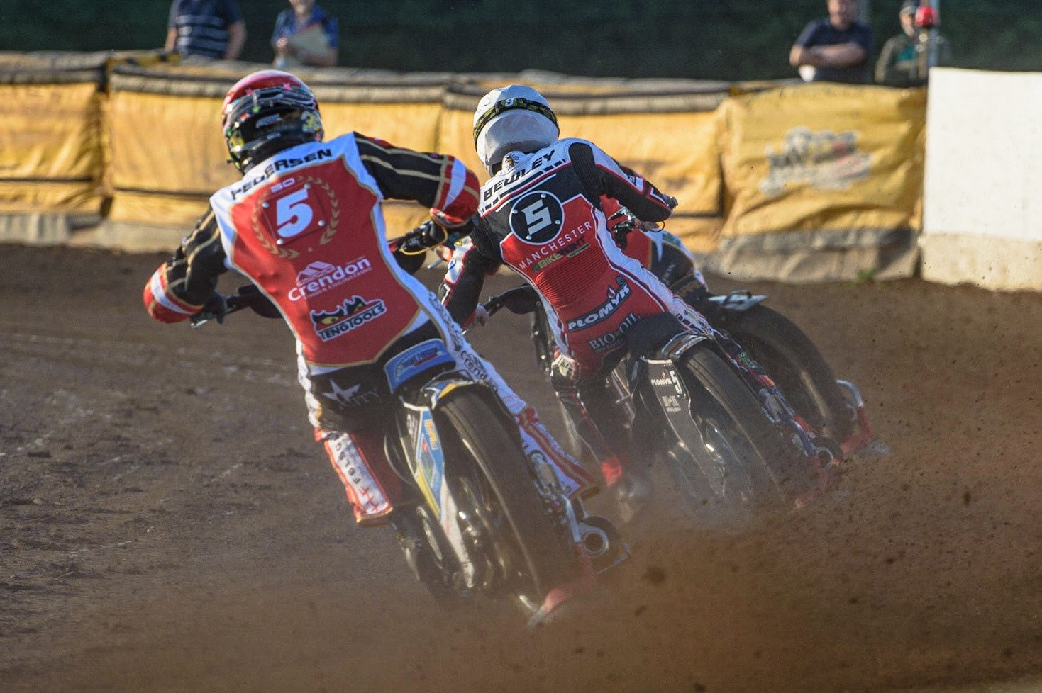 PETERBOROUGH, UK. JULY 19TH  Bjarne Pedersen  (Red) chases Dan Bewley  (White) during the SGB Premiership match between Peterborough and Belle Vue Aces at East of England Showground, Peterborough on Monday 19th July 2021. (Credit: Ian Charles | MI News)