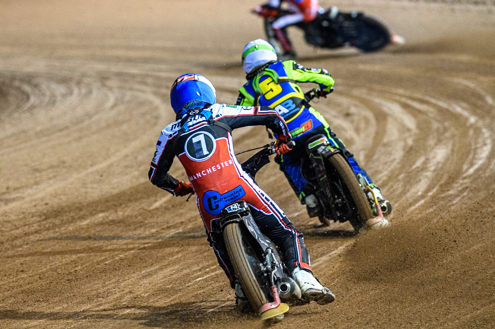 Belle Vue Colts' Harry McGurk in Blue chases Sheffield Cubs' Luke Harrison in White during the WSRA National Development League match between Belle Vue Colts and Sheffield Tiger Cubs at the National Speedway Stadium, Manchester on Monday 7th October 2024. (Photo: Ian Charles | MI News)