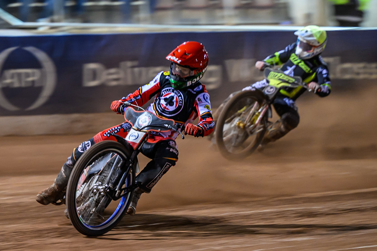 Brady Kurtz of Belle Vue Aces  in Red leading Jason Doyle of Ipswich Witches  in White during the Rowe Motor Oil Premiership Play Off Semi Final 1 (1st Leg)  between Belle Vue Aces and Ipswich Witches at the National Speedway Stadium, Manchester on Monday 8th September 2025. (Photo: Ian Charles | MI News)