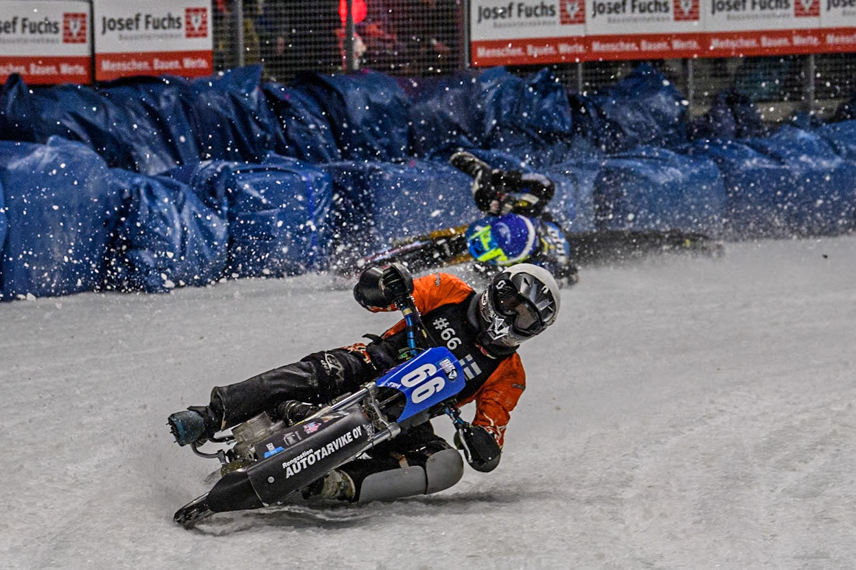 Finland's Aki Ala-Riihimäki (66) (White) leads  as Sweden's Martin Haarahiltunen (199)  (Blue) crashes out during the FIM Ice Speedway Gladiators World Championship Final 2 at the Max-Aicher-Arena, Inzell on Sunday 24 March 2024. (Photo: Ian Charles | MI News)