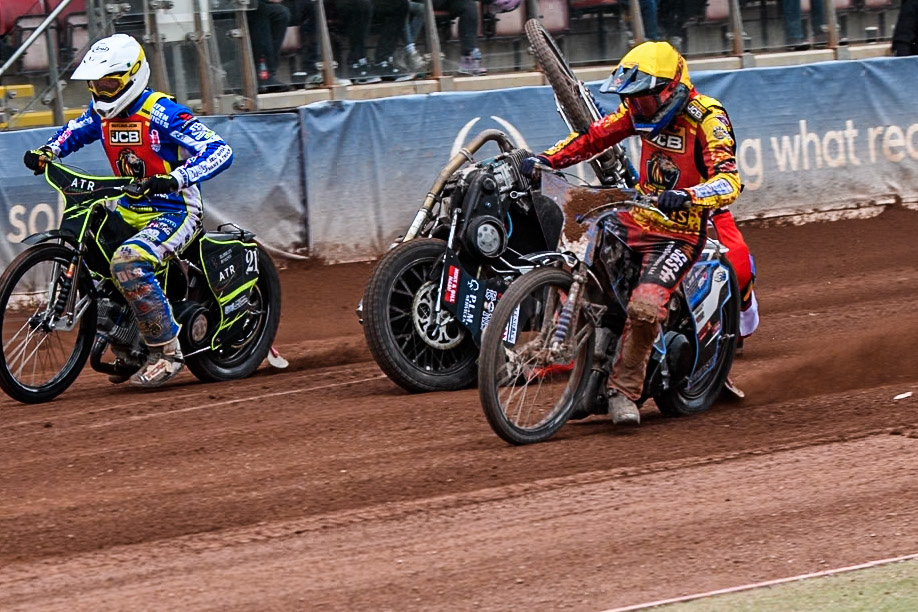 Belle Vue Colts' Billy Budd rears at the start between Leicester Lion Cubs' Guest Rider Darryl Ritchings in White and Leicester Lion Cubs' Sonny Springer in Yellow during the WSRA National Development League match between Belle Vue Colts and Leicester Lion Cubs at the National Speedway Stadium, Manchester on Friday 18th April 2025. (Photo: Ian Charles | MI News)