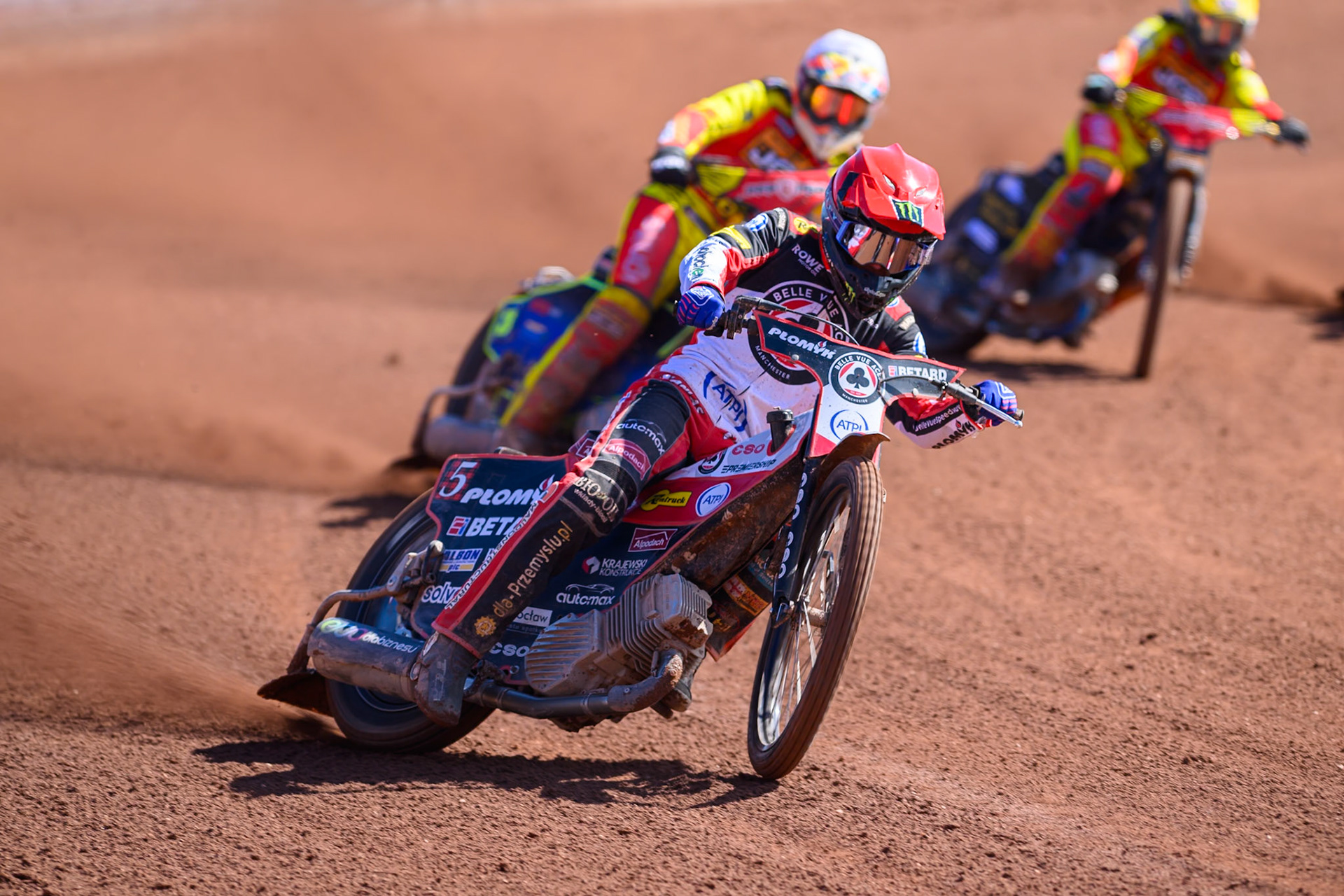 Dan Bewley  of Belle Vue Aces  in Red leading Nick Morris of Leicester Lions  in White and Kyle Howarth of Leicester Lions  in Yellow during the Knockout Cup Northern Section match between Belle Vue Aces and Leicester Lions at the National Speedway Stadium, Manchester on Monday 6th April 2026. (Photo: Ian Charles | MI News)