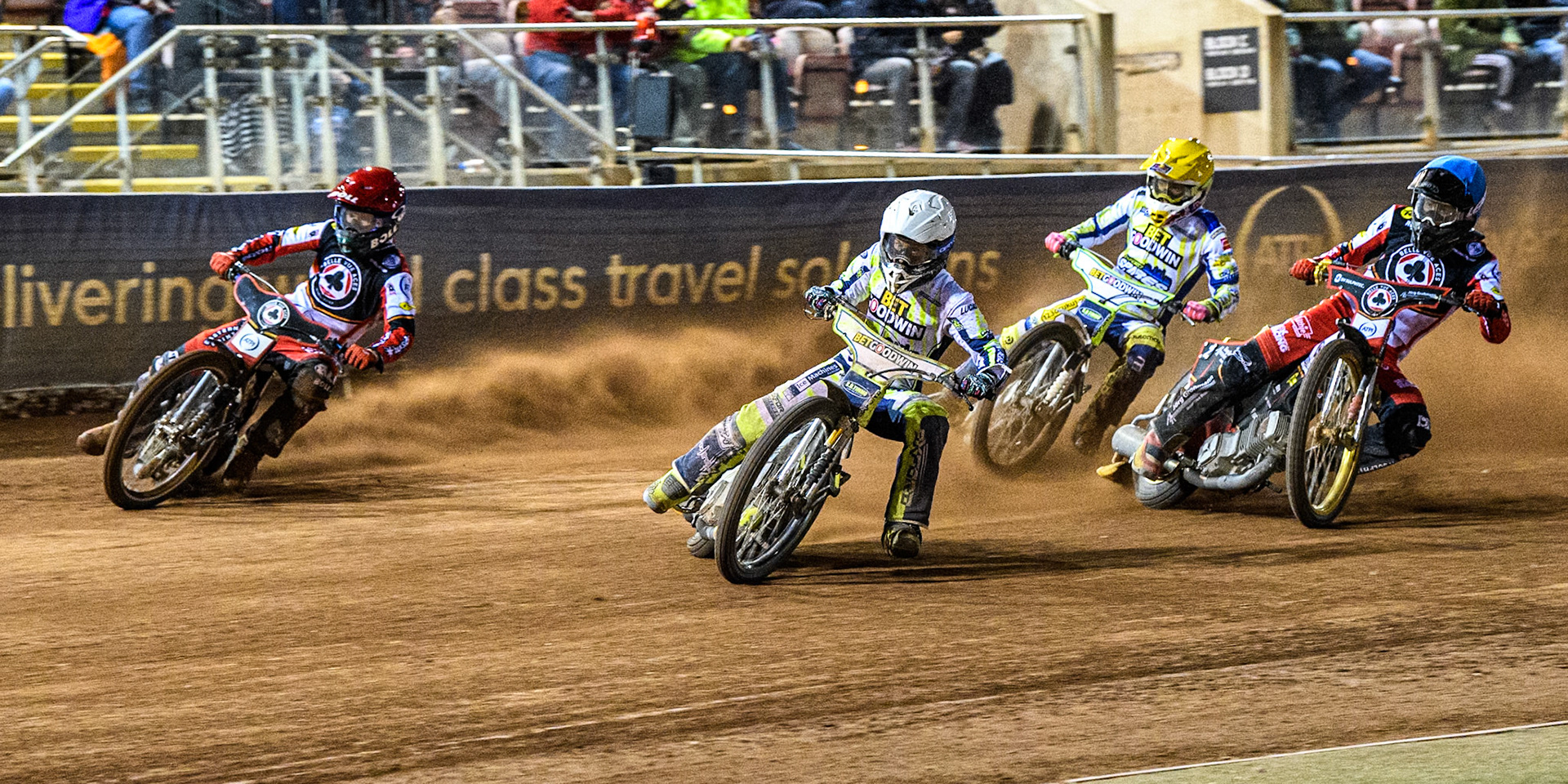 Oxford Spires' Rohan Tungate in White leading Belle Vue Aces' Brady Kurtz in Red, Oxford Spires' Maciej Janowski in Yellow and Belle Vue Aces' Norick Blodorn in Blue during the Rowe Motor Oil Premiership match between Belle Vue Aces and Oxford Spires at the National Speedway Stadium, Manchester on Monday 14th April 2025. (Photo: Ian Charles | MI News)