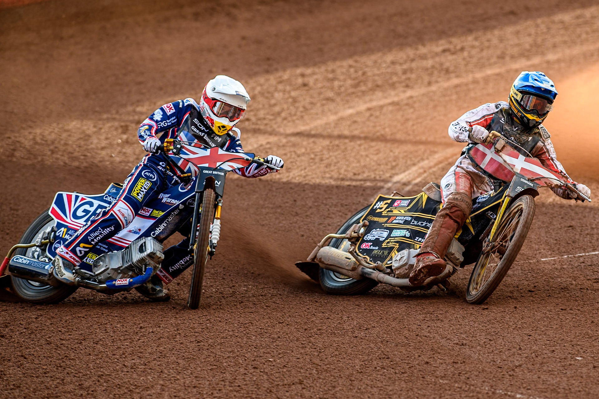 DENMARK v GREAT BRITAIN: Robert Lambert of Great Britain in White rides outside Anders Thomsen of Denmark in Blue during the Monster Energy FIM Speedway of Nation Final at the National Speedway Stadium, Manchester on Saturday 13th July 2024. (Photo: Ian Charles | MI News)