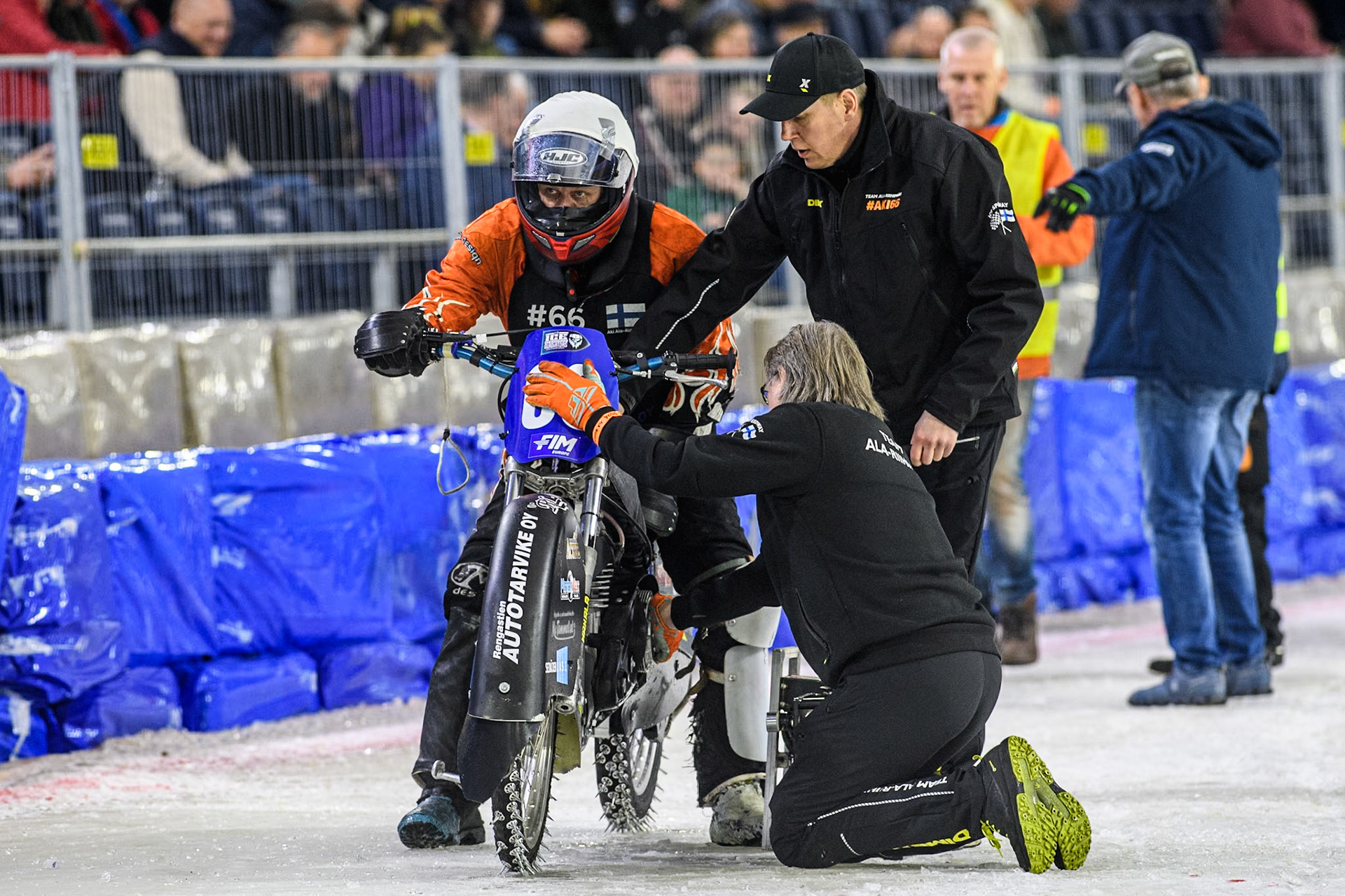 Finland's Aki Ala-Riihimäki’ team work on his bike after the heat is stopped during the FIM Ice Speedway Gladiators World Championship Final 3 at Ice Rink Thialf, Heerenveen on Saturday 6th April 2024. (Photo: Ian Charles | MI News)