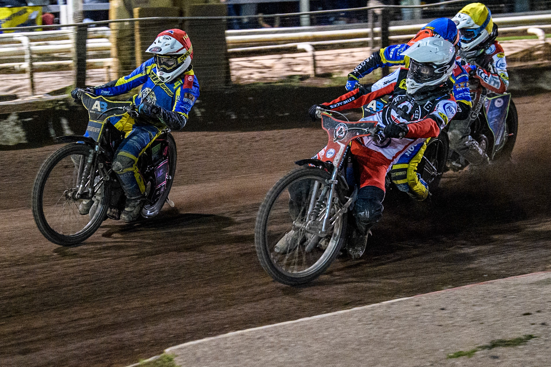 The deciding Heat 14 - Belle Vue Aces' Antti Vuolas  in White rides inside Sheffield Tigers' Josh Pickering  in Red with Sheffield Tigers' Jason Edwards  in Blue and Belle Vue Aces' Jake Mulford  in Yellow behind during the Rowe Motor Oil Premiership Play Off Semi Final 2nd leg between Sheffield Tigers and Belle Vue Aces at Owlerton Stadium, Sheffield on Thursday 19th September 2024. (Photo: Ian Charles | MI News)