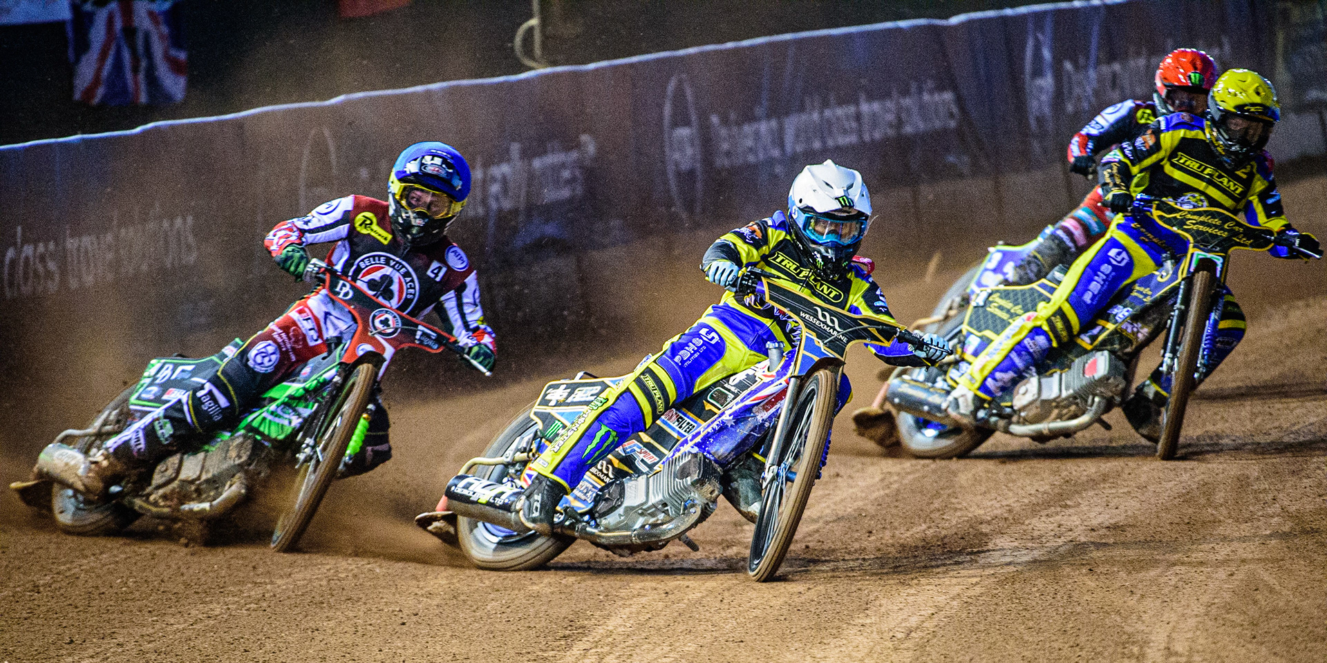 Jack Holder  (White) inside Charles Wright  (Blue) ahead of Kyle Howarth  (Yellow) and Jaimon Lidsey  (Red) during the SGB Premiership match between Belle Vue Aces and Sheffield Tigers at the National Speedway Stadium, Manchester on Monday 27th March 2023. (Photo: Ian Charles | MI News)
