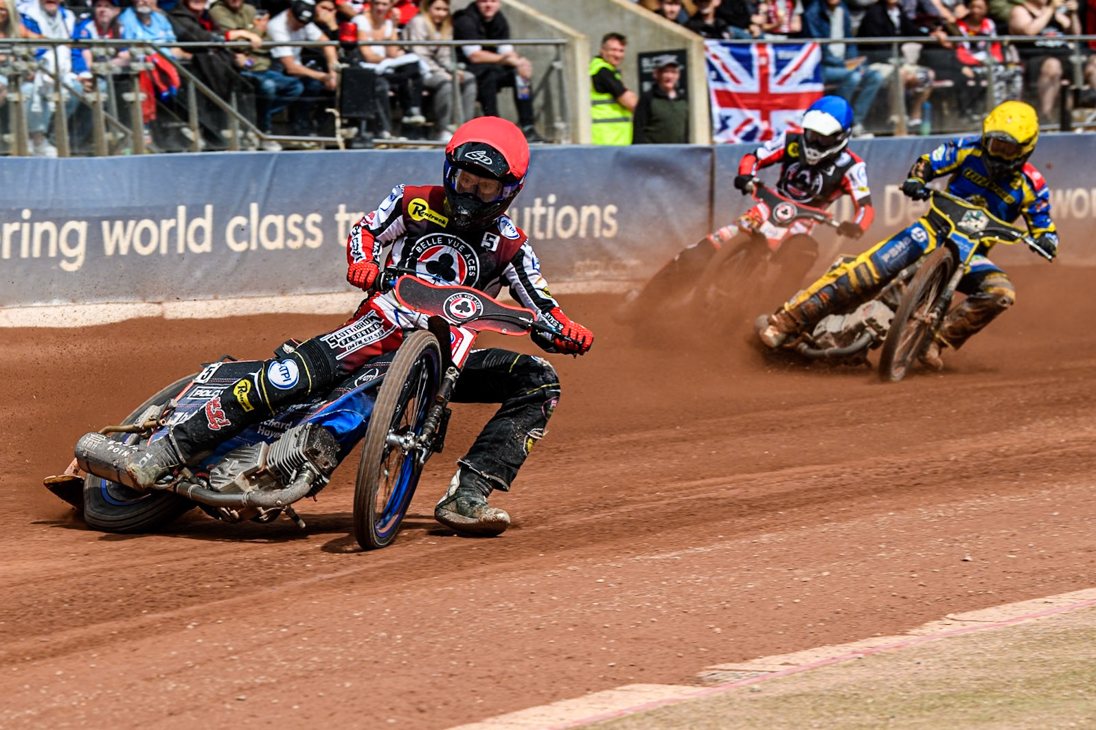 Belle Vue Aces' Brady Kurtz  in Red leading Sheffield Tigers' Kyle Howarth in Yellow and Belle Vue Aces' Antti Vuolas  in Blue during the Rowe Motor Oil Premiership match between Belle Vue Aces and Sheffield Tigers at the National Speedway Stadium, Manchester on Monday 26th August 2024. (Photo: Ian Charles | MI News)