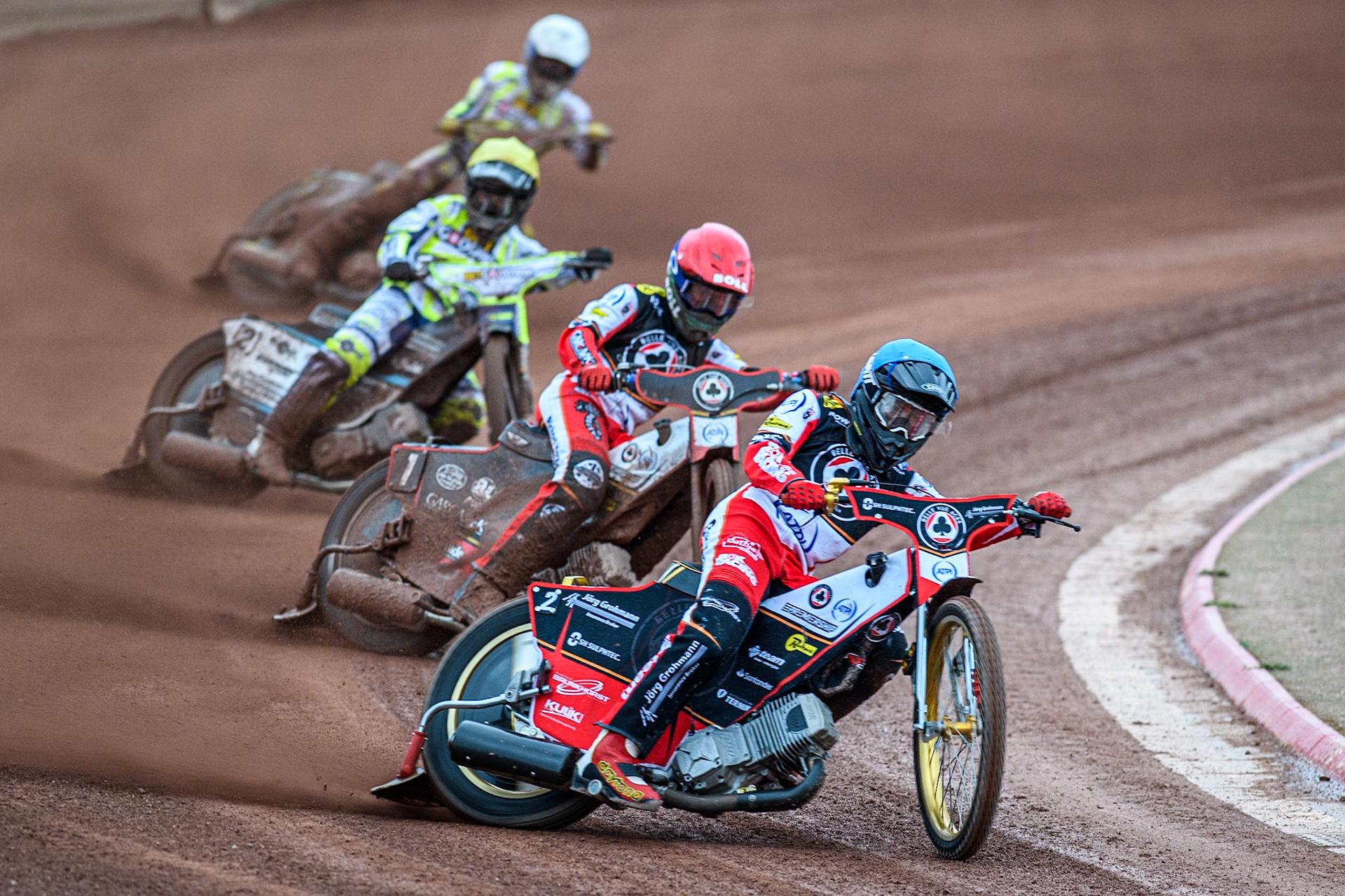 Belle Vue Aces' Norick Blodorn in Blue leading Belle Vue Aces' Brady Kurtz in Red,Oxford Spires' Erik Riss in Yellow and Oxford Spires' Rohan Tungate in White during the Rowe Motor Oil Premiership match between Belle Vue Aces and Oxford Spires at the National Speedway Stadium, Manchester on Monday 14th April 2025. (Photo: Ian Charles | MI News)