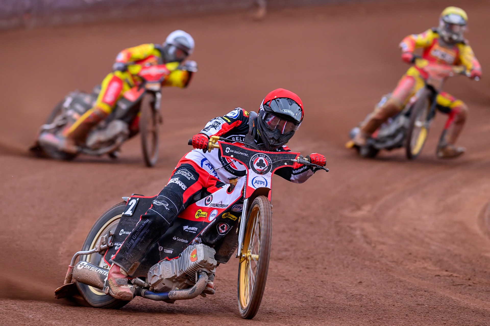Norick Blödorn of Belle Vue Aces in Red leading Dan Thompson of Leicester Lions in White and Joe Thompson of Leicester Lions in Yellow during the Rowe Motor Oil Premiership match between Belle Vue Aces and Leicester Lions at the National Speedway Stadium, Manchester on Monday 15th June 2026. (Photo: Ian Charles | MI News)
