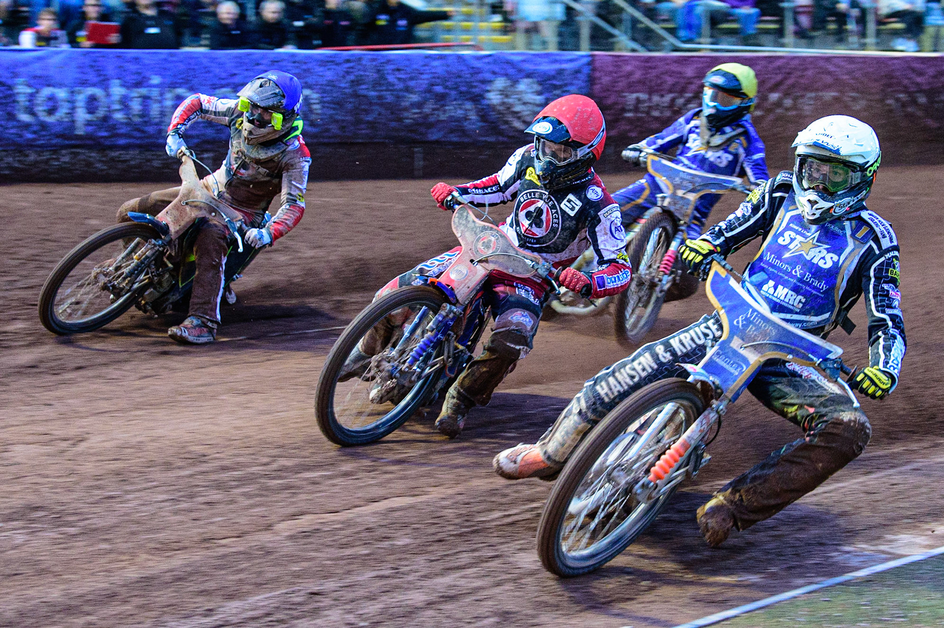 MANCHESTER, UK. MAY 16TH Niels-Kristian Iversen  (White) inside Brady Kurtz  (Red) with Norick Blödorn  (Blue) and Thomas Jorgensen  (Yellow) behind during the SGB Premiership match between Belle Vue Aces and King's Lynn Stars at the National Speedway Stadium, Manchester on Monday 16th May 2022. (Credit: Ian Charles | MI News)