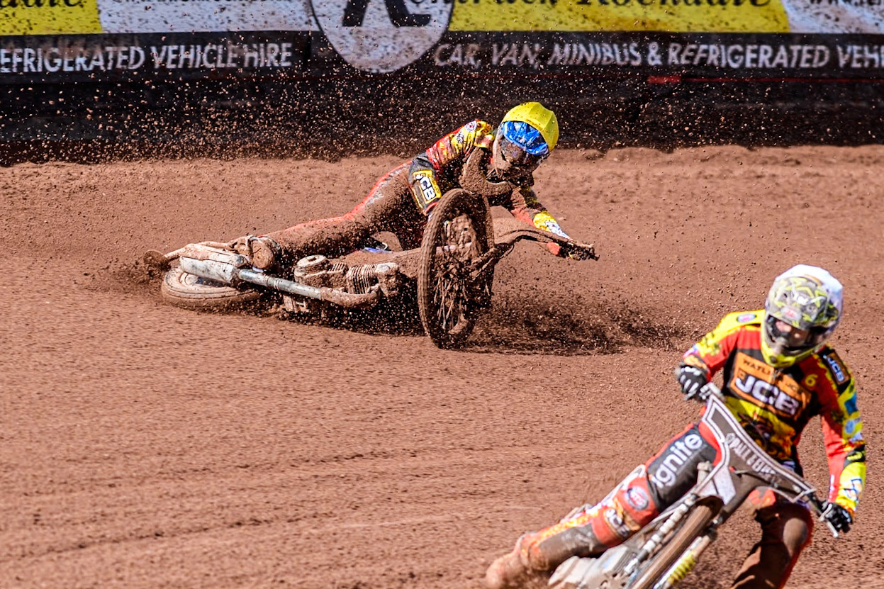 Leicester Lion Cubs' Sonny Springer  (Yellow) falls behind team mate Leicester Lion Cubs' Luke Crang (White) during the WSRA  National Development League match between Belle Vue Colts and Leicester Lion Cubs at the National Speedway Stadium, Manchester on Friday 29th March 2024. (Photo: Ian Charles | MI News)