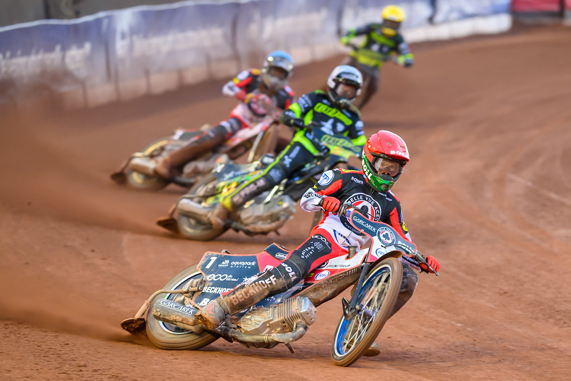 Brady Kurtz of Belle Vue Aces in Red leading Tobiasz Musielak of Ipswich Witches in White Norick Blödorn of Belle Vue Aces  in Blue and Philip Hellstrom-Bangs of Ipswich Witches  in Yellow during the Rowe Motor Oil Premiership match between Belle Vue Aces and Ipswich Witches at the National Speedway Stadium, Manchester on Monday 20th April 2026. (Photo: Ian Charles | MI News)