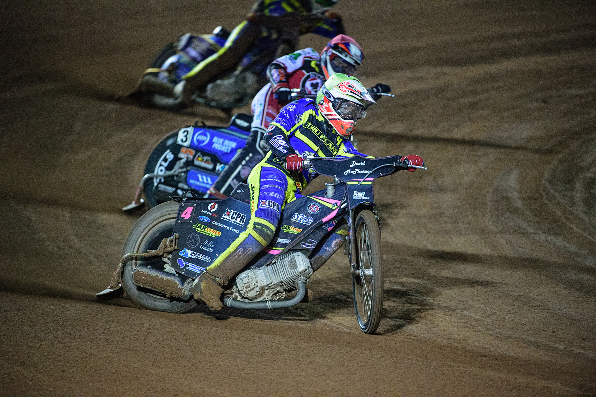 MANCHESTER, UK. OCT 7TH  Josh Pickering   (Yellow) leads Steve Worrall   (Red) and Kyle Howarth  (White) during the SGB Premiership Play off Semi-Final Second Leg between Belle Vue Aces and Sheffield Tigers at the National Speedway Stadium, Manchester on Thursday 7th October 2021. (Credit: Ian Charles | MI News)