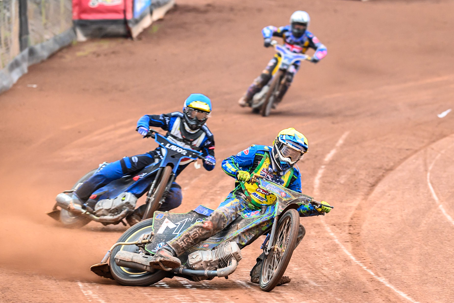 Michael West of Australia in Yellow leading Antoni Mencel of Poland in Blue and Joe Thompson of Great Britain in White during the FIM SGP2 Qualifying Round at the Peugeot Ashfield Stadium in Glasgow on Saturday 24th May 2025. (Photo: Ian Charles | MI News)
