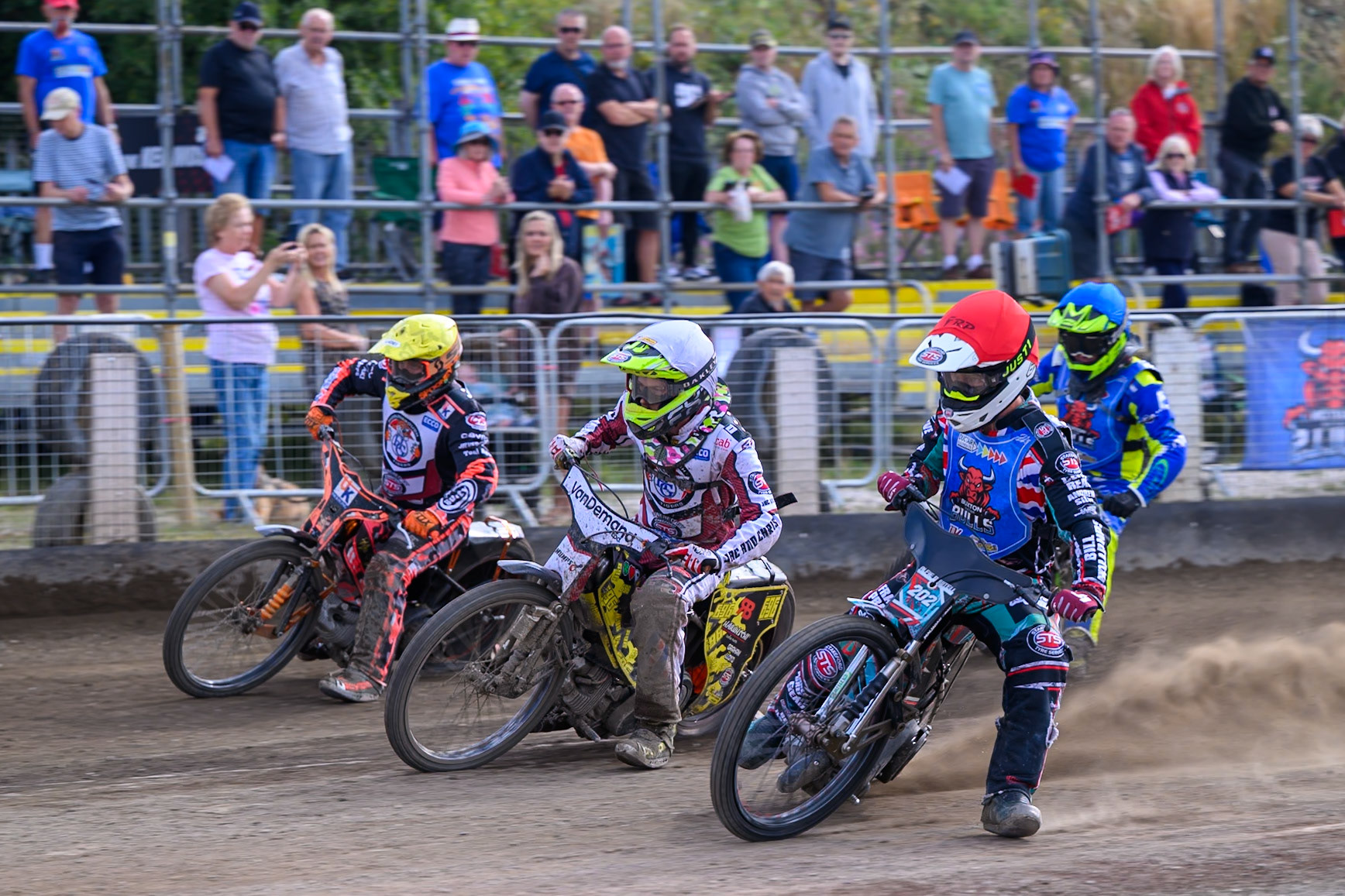 Alfie Bowtell of Buxton Bulls in Red on the inside of Ace Pijper of Middlesborough Tigers in White  and Alex Spooner of Middlesborough Tigers in Yellow  with Will Boraston of Buxton Bulls in Blue  behind during the WSRA National Development League match  between Buxton Bulls and Middlesborough Tigers at Hi-Edge Speedway, Buxton on Sunday 16th August 2026. (Photo: Ian Charles | MI News)