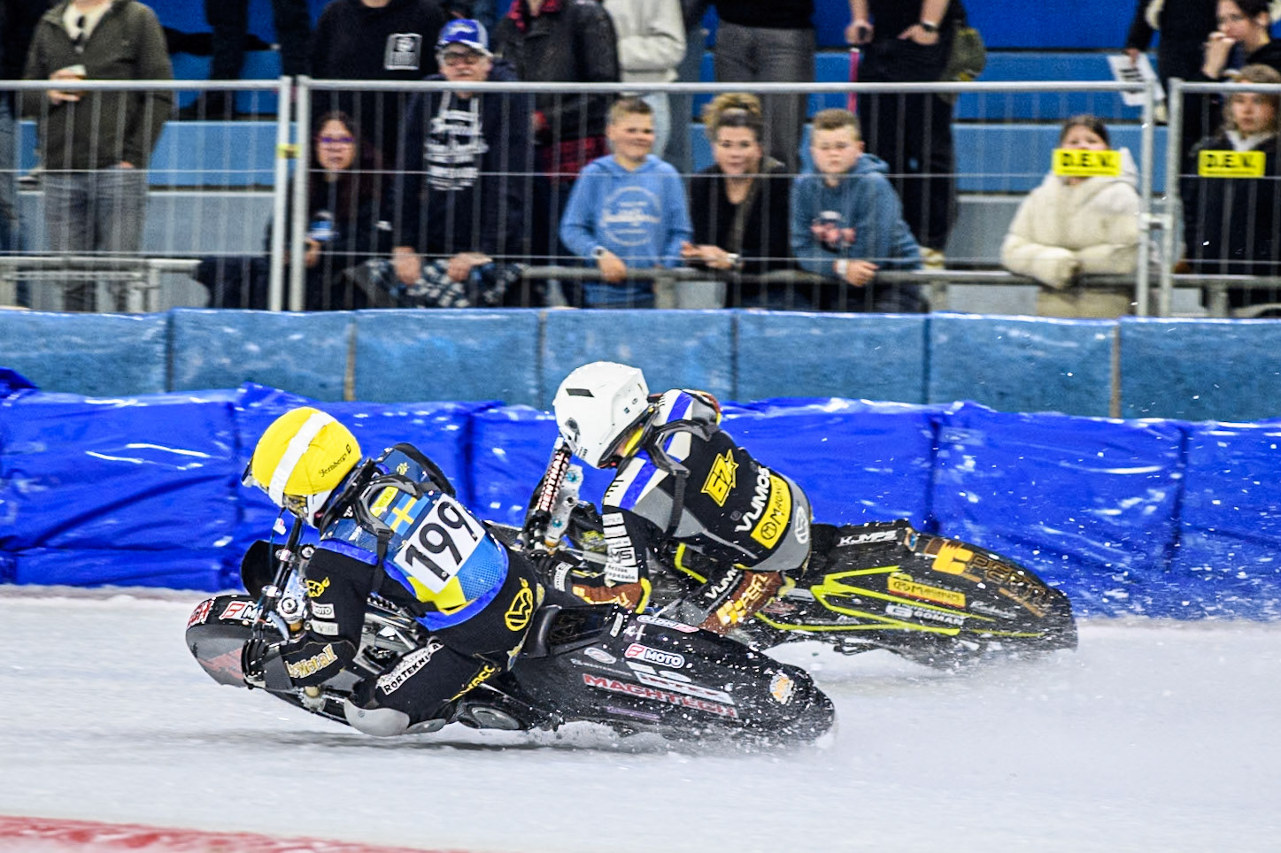 Martin Haarahiltunen (199) of Sweden in Yellow rides inside Heikki Huusko (67) of Finland in White during the FIM Ice Speedway Gladiators World Championship, Final 4 at the Ice Stadium, Thialf, Heerenveen on Sunday 6th April 2025. (Photo: Ian Charles | MI News)