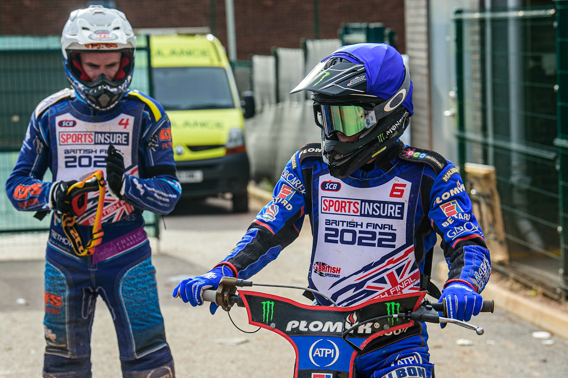 Dan Bewley  rides out of the pits watched by Steve Worrall  (left) during the Sports Insure British Speedway Final, at the National Speedway Stadium, Manchester, on Sunday 18th September 2022. (Credit: Ian Charles | MI News )