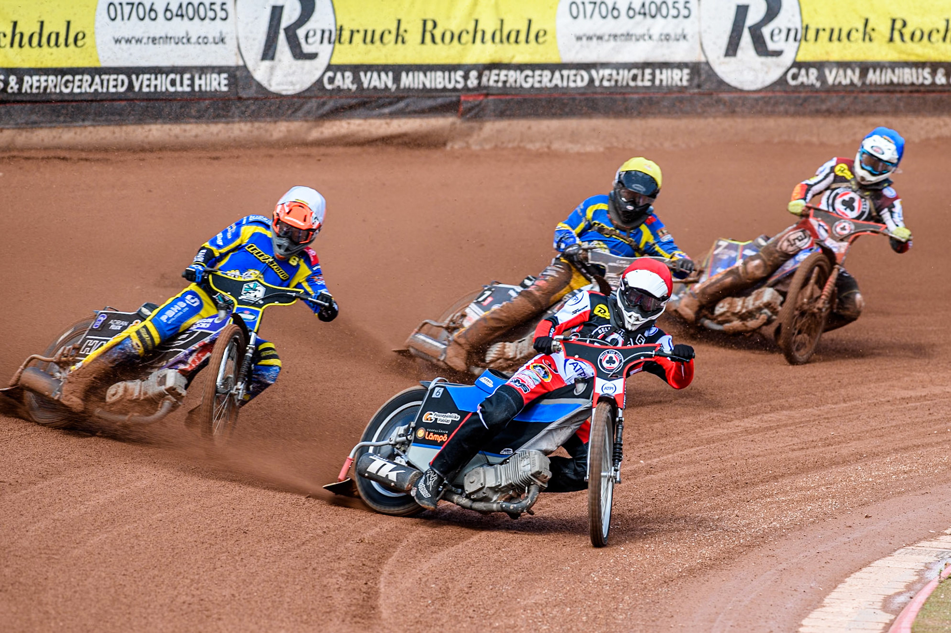 Belle Vue Aces' Antti Vuolas in Red leading Sheffield Tigers' Jason Edwards  in White, Sheffield Tigers' Guest Rider Joe Thompson  in Yellow and Belle Vue Aces' Jake Mulford  in Blue during the Rowe Motor Oil Premiership match between Belle Vue Aces and Sheffield Tigers at the National Speedway Stadium, Manchester on Monday 26th August 2024. (Photo: Ian Charles | MI News)