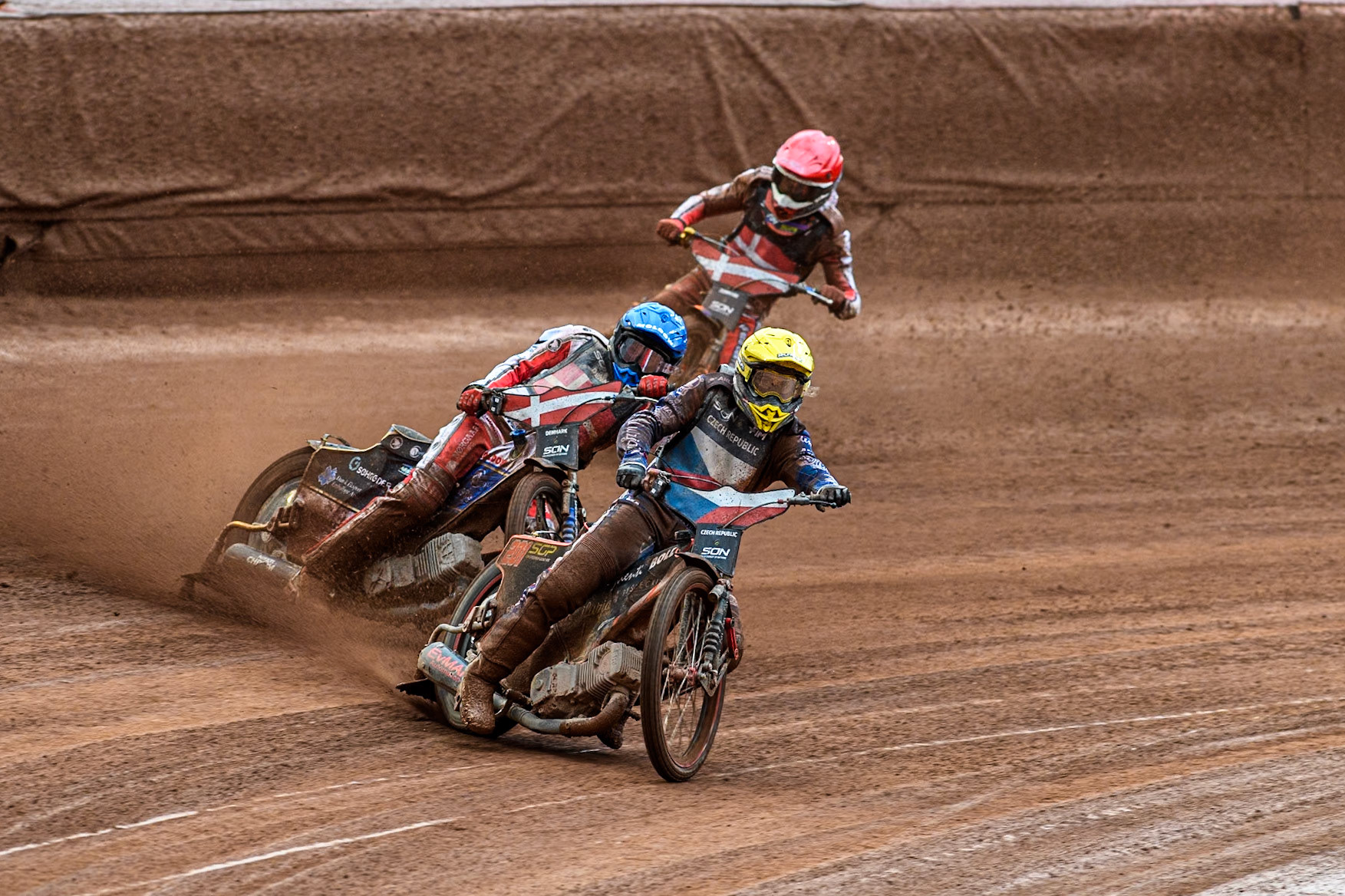 Jan Kvech of The Czech Republic in Yellow leading Anders Thomsen of Denmark in Blue and Mikkel Michelsen of Denmark in Red during the Monster Energy FIM Speedway of Nation Semi Final 2 at the National Speedway Stadium, Manchester on Wednesday 10th July 2024. (Photo: Ian Charles | MI News)