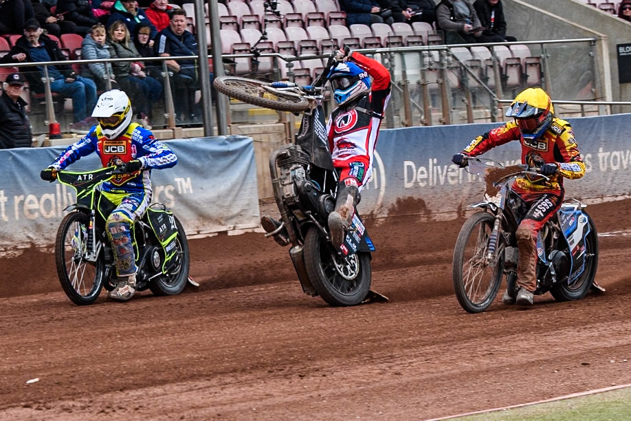 Belle Vue Colts' Billy Budd rears at the start between Leicester Lion Cubs' Guest Rider Darryl Ritchings in White and Leicester Lion Cubs' Sonny Springer in Yellow during the WSRA National Development League match between Belle Vue Colts and Leicester Lion Cubs at the National Speedway Stadium, Manchester on Friday 18th April 2025. (Photo: Ian Charles | MI News)