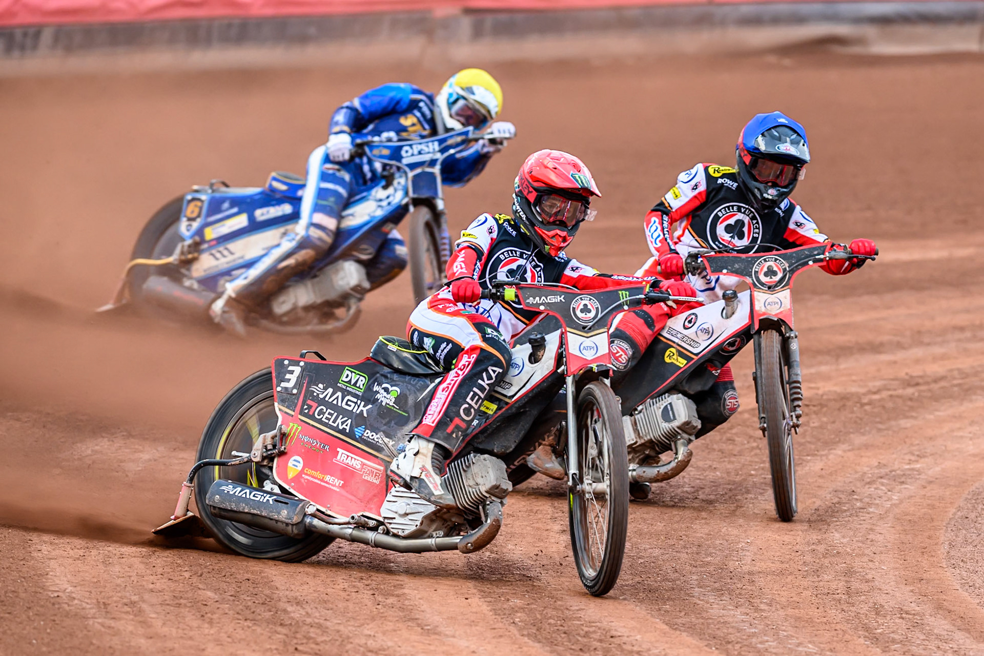 Belle Vue Aces' Jaimon Lidsey in Red leading Belle Vue Aces' Zach Cook in Blue and Kings Lynn Stars' Guest Rider, Anders Rowe in Yellow during the Rowe Motor Oil Premiership match between Belle Vue Aces and King's Lynn Stars at the National Speedway Stadium, Manchester on Monday 23rd June 2025. (Photo: Ian Charles | MI News)