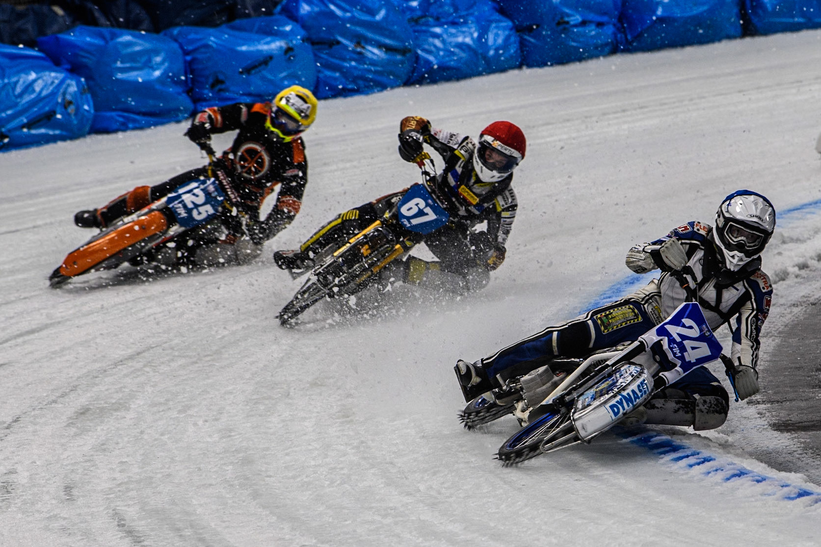 Max Koivula (24) of Finland in Blue leading Heikki Huusko (67) of Finland in Red and Sebastian Reitsma (125) of The Netherlands in Yellow during the Ice Speedway Gladiators World Championship Final 2 at Max-Aicher-Arena, Inzell on Sunday 16th March 2025. (Photo: Ian Charles | MI News)
