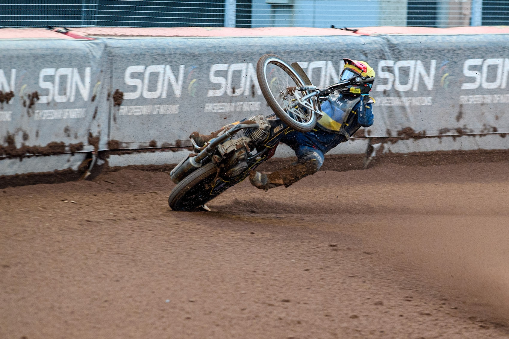 Marko Levishyn of Ukraine in Yellow crashes out of his final heat during the Monster Energy FIM Speedway of Nations Semi-Final 1 at the National Speedway Stadium, Manchester on Tuesday 9th July 2024. (Photo: Ian Charles | MI News)