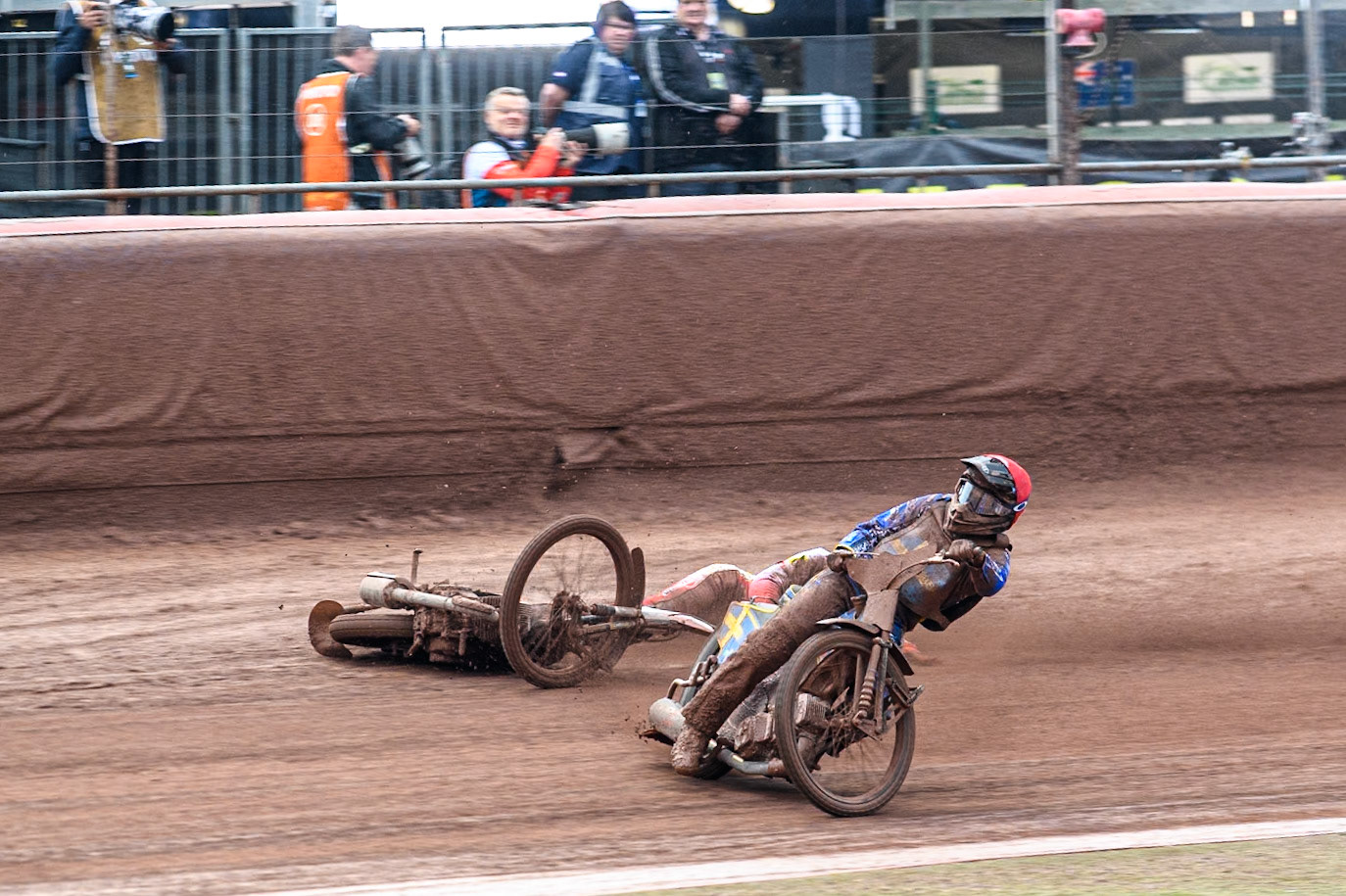 Bartosz Banbor of Poland falls behind Philip Hellström-Bängs of Sweden in Red during the Monster Energy FIM Speedway of Nations 2 (Under 21) Final at the National Speedway Stadium, Manchester on Friday 12th July 2024. (Photo: Ian Charles | MI News)