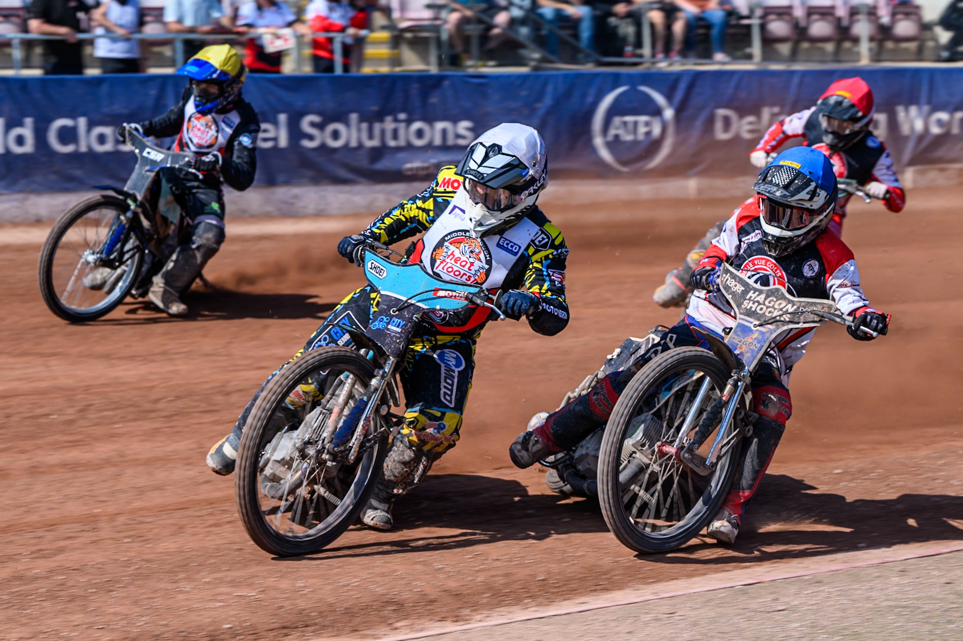 Jamie Halder of Middlesborough Tigers  in White leading Harry Fletcher of Belle Vue Colts  in Blue, Charlie Southwick of Middlesborough Tigers  in Yellow and Mason Watson of Belle Vue Colts \er\during the WSRA National Development League match between Belle Vue Colts and Middlesbrough Tigers at the National Speedway Stadium, Manchester on Sunday 10th August 2025. (Photo: Mark Fletcher | MI News)