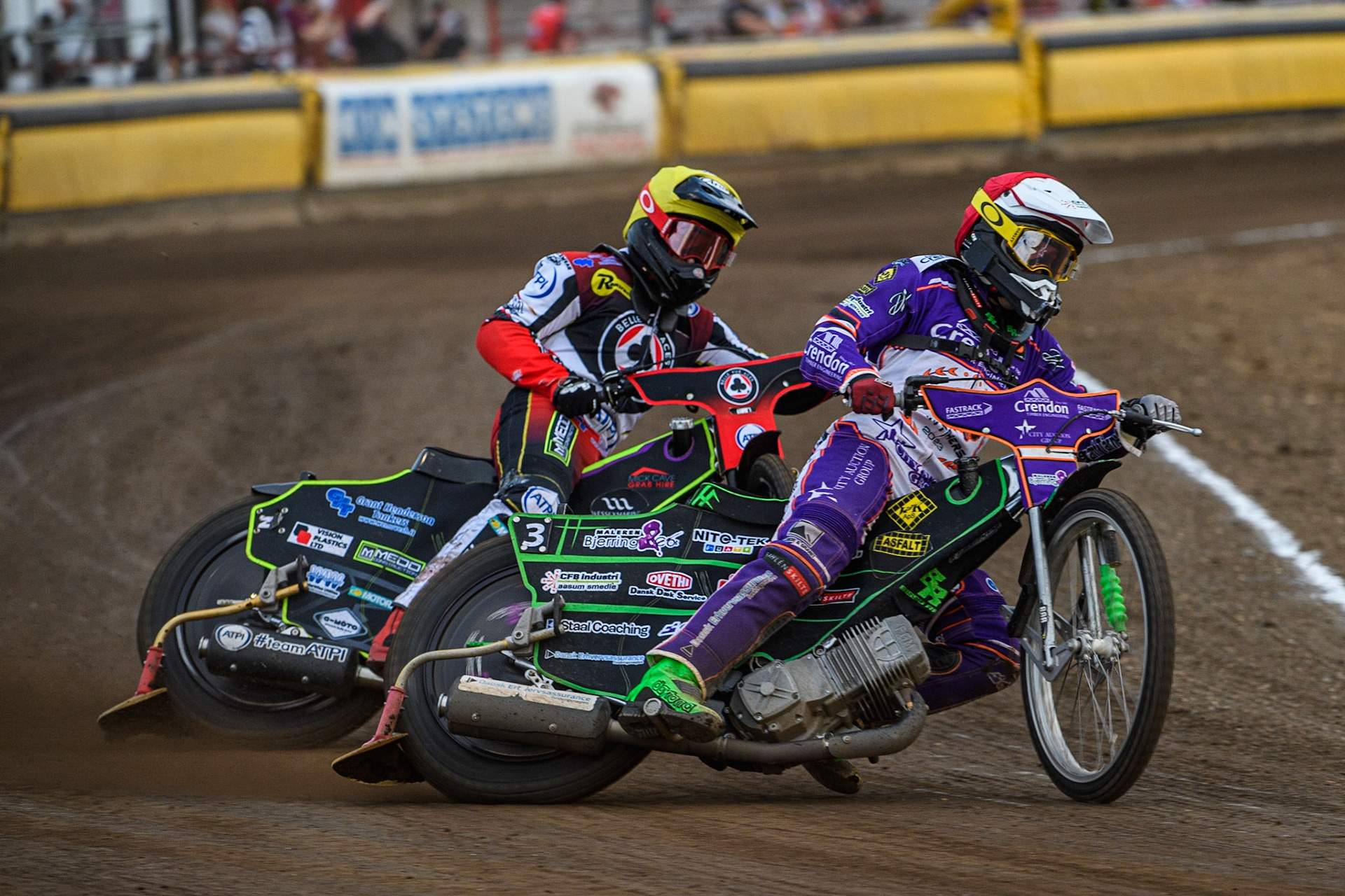 Benjamin Basso (Red) leads Tom Brennan (Yellow) during the Sports Insure Premiership match between Peterborough and Belle Vue Aces at East of England Showground, Peterborough on Monday 26th June 2023. (Photo: Ian Charles | MI News)