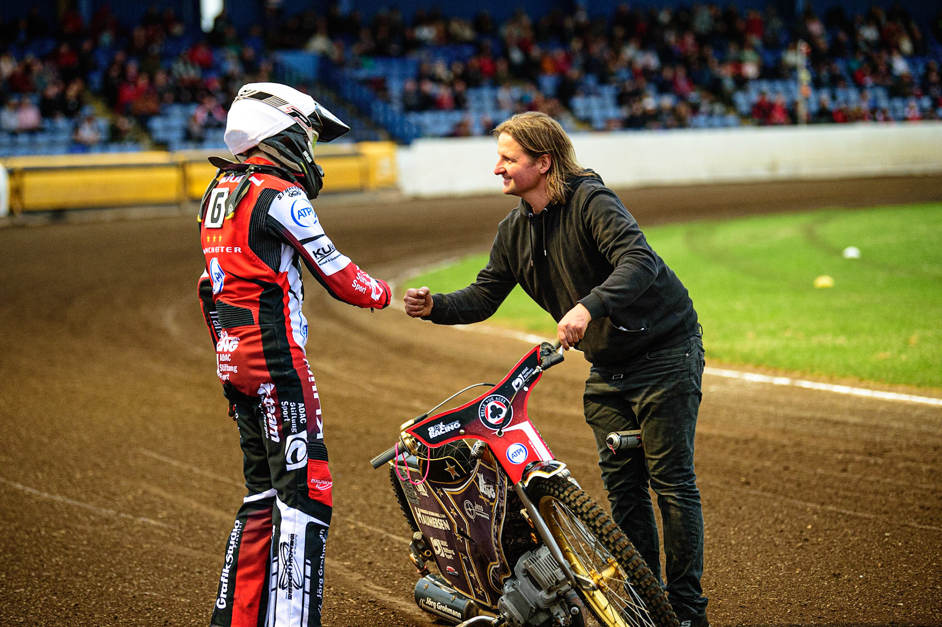 PETERBOROUGH, UK. MAY 9TH  Norick Blödorn (left) is congratulated by his mechanic Robbie Kessler, on his first heat win for Belle Vue ATPI Aces  during the SGB Premiership match between Peterborough Panthers and Belle Vue Aces at East of England Showground, Peterborough on Monday 9th May 2022. (Credit: Ian Charles | MI News)