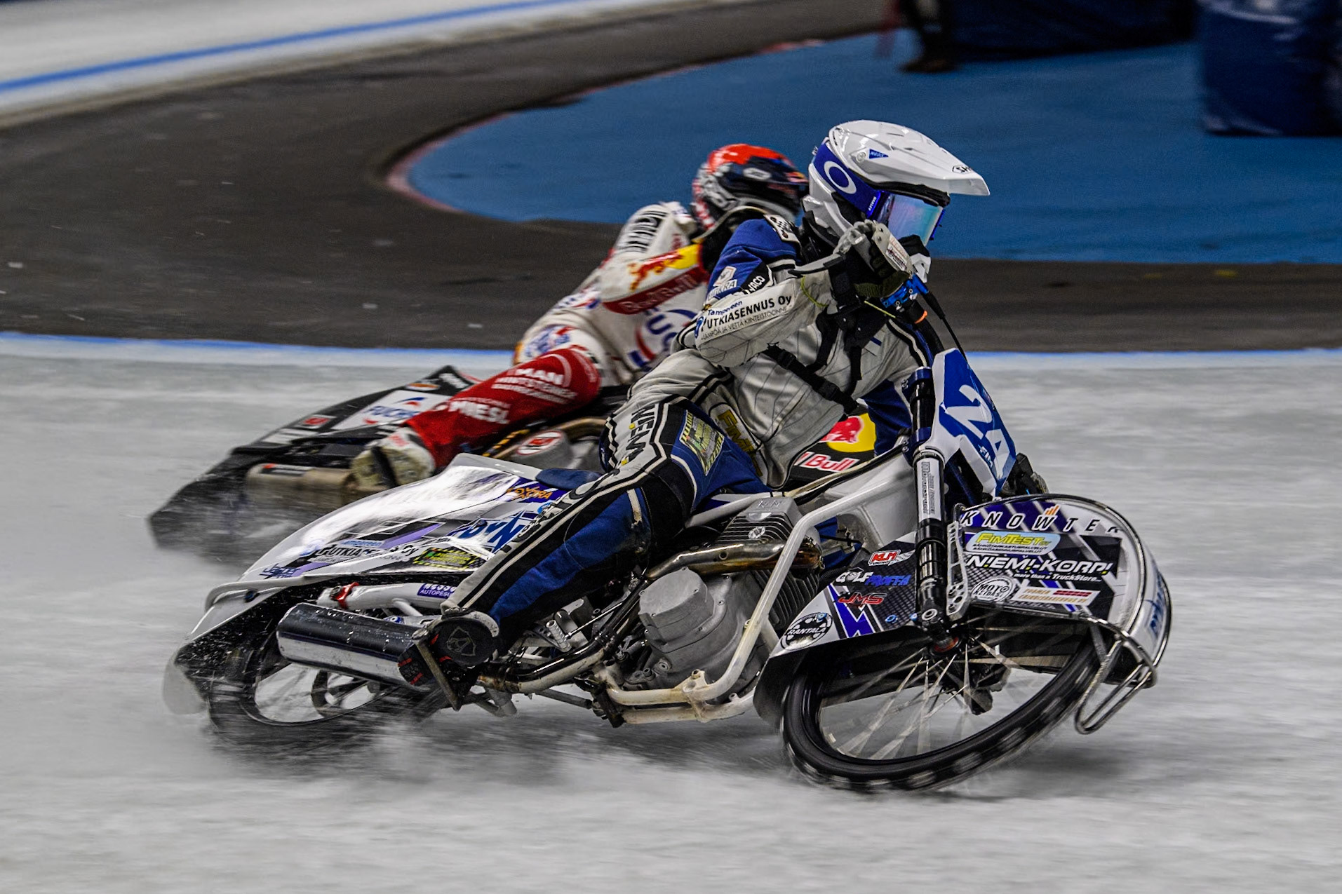 Finland's Max Koivula (24)  (White) outside Austria's Franz Zorn (100) (Red) during the FIM Ice Speedway Gladiators World Championship Final 1 at the Max-Aicher-Arena, Inzell on Saturday 23 March 2024. (Photo: Ian Charles | MI News)