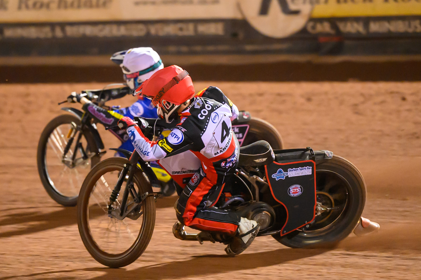 Zach Cook of Belle Vue Aces   in Red chases Leon Flint of Sheffield Tigers    in White during the Knockout Cup, Northern Section match between Belle Vue Aces and Sheffield Tigers at the National Speedway Stadium, Manchester on Monday 30th March 2026. (Photo: Ian Charles | MI News)