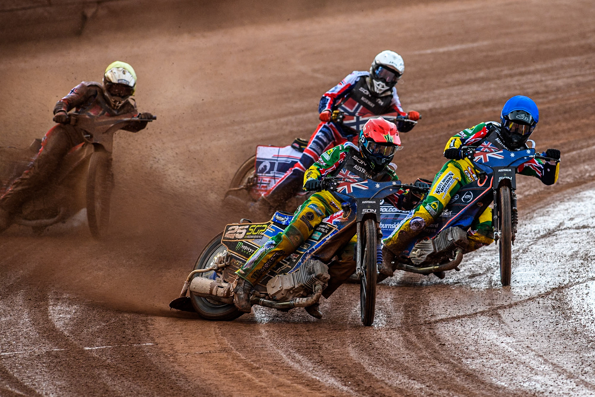 Australia v Norway: Jack Holder of Australia in Red rides outside team mate Brady Kurtz of Australia in Blue with Mathias Pollestad of Norway in White and Truls Kamhaug of Norway in Yellow behind during the Monster Energy FIM Speedway of Nation Semi Final 2 at the National Speedway Stadium, Manchester on Wednesday 10th July 2024. (Photo: Ian Charles | MI News)