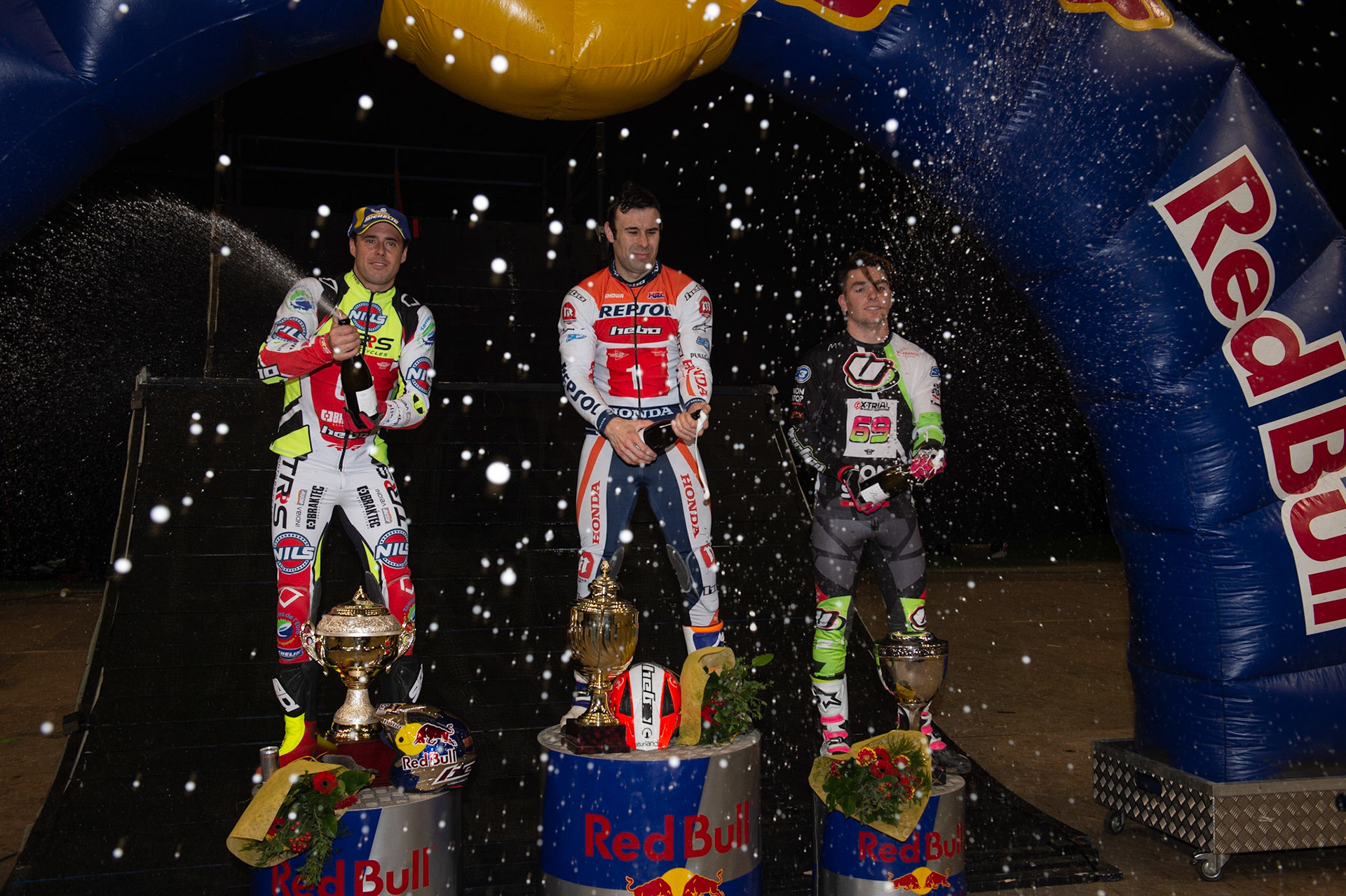SHEFFIELD, ENGLAND  - DECEMBER 28TH  Top 3 - (l-r) Adam Raga (2nd), Tony Bou (Winner) Jamie Busto (3rd) spray the Champagne during the 25th Anniversary Sheffield Indoor Trial at the FlyDSA Arena, Sheffield on Saturday 28th December 2019. (Credit: Ian Charles | MI News)