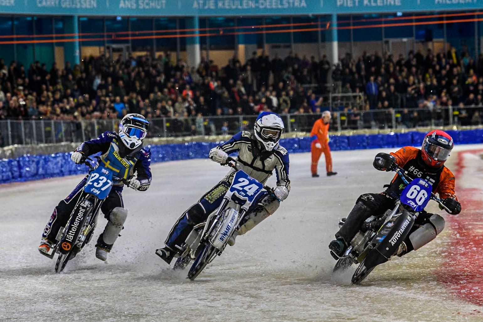 \68\ in Red rides inside Finland's Max Koivula (24) in White and Sweden's Jimmy Hörnell Lidfalk (237) in Yellow during the FIM Ice Speedway Gladiators World Championship Final 4 at Ice Rink Thialf, Heerenveen on Sunday 7th April 2024. (Photo: Ian Charles | MI News)