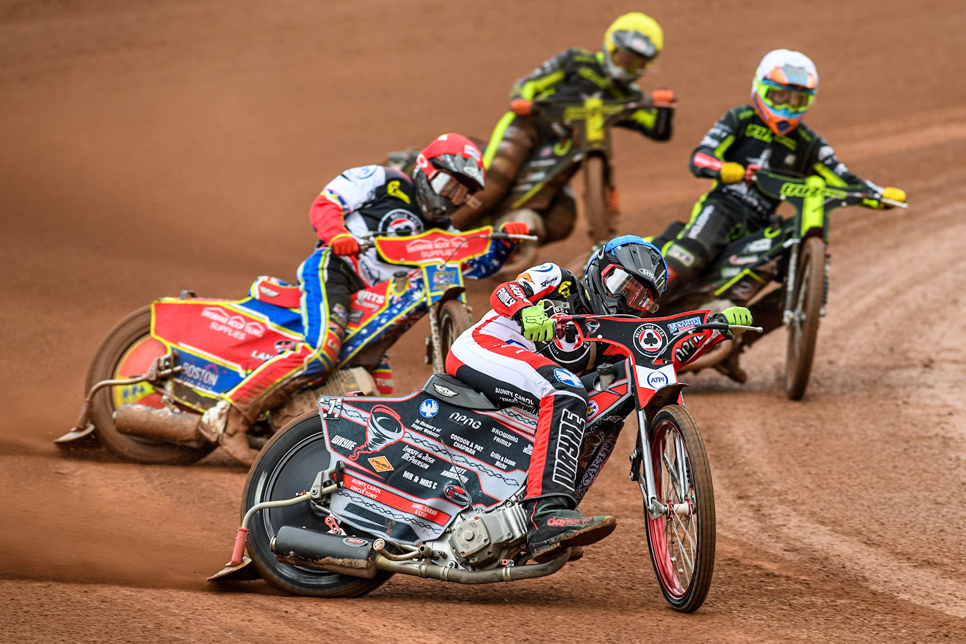 Belle Vue Aces' Connor Bailey  in Blue and team mate Belle Vue Aces' Tate Zischke  in Red leading Ipswich Witches' Keynan Rew in White and Ipswich Witches' Jordan Jenkins in Yellow during the Rowe Motor Oil Premiership match between Belle Vue Aces and Ipswich Witches at the National Speedway Stadium, Manchester on Monday 1st July 2024. (Photo: Ian Charles | MI News)