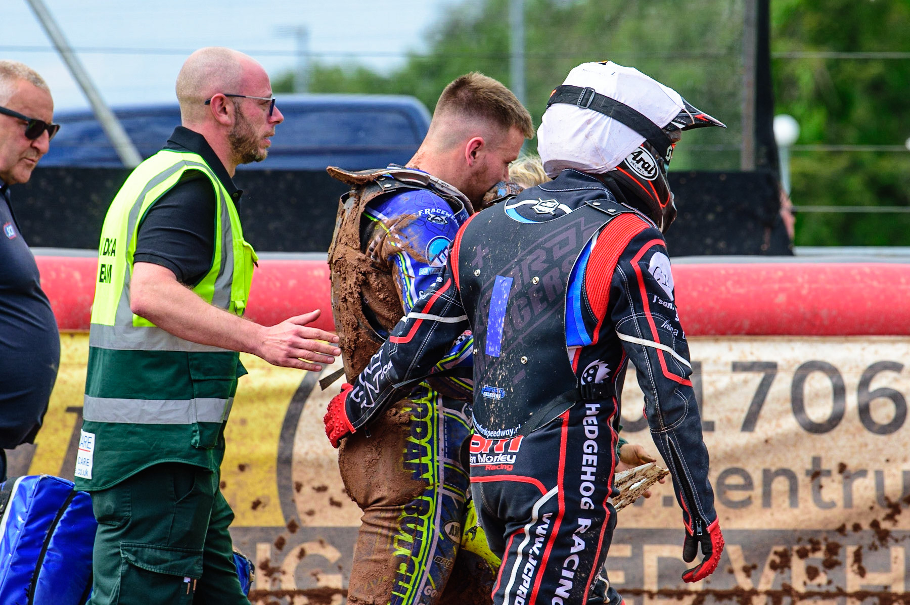 MANCHESTER, UK.  JUN 3RD  Arran Butcher  (centre( walks back to the pits with team mate Jake Mulford   and the paramedic after his post race fall during the National Development League match between Belle Vue Colts and Oxford Chargers at the National Speedway Stadium, Manchester on Friday 3rd June 2022. (Credit: Ian Charles | MI News)