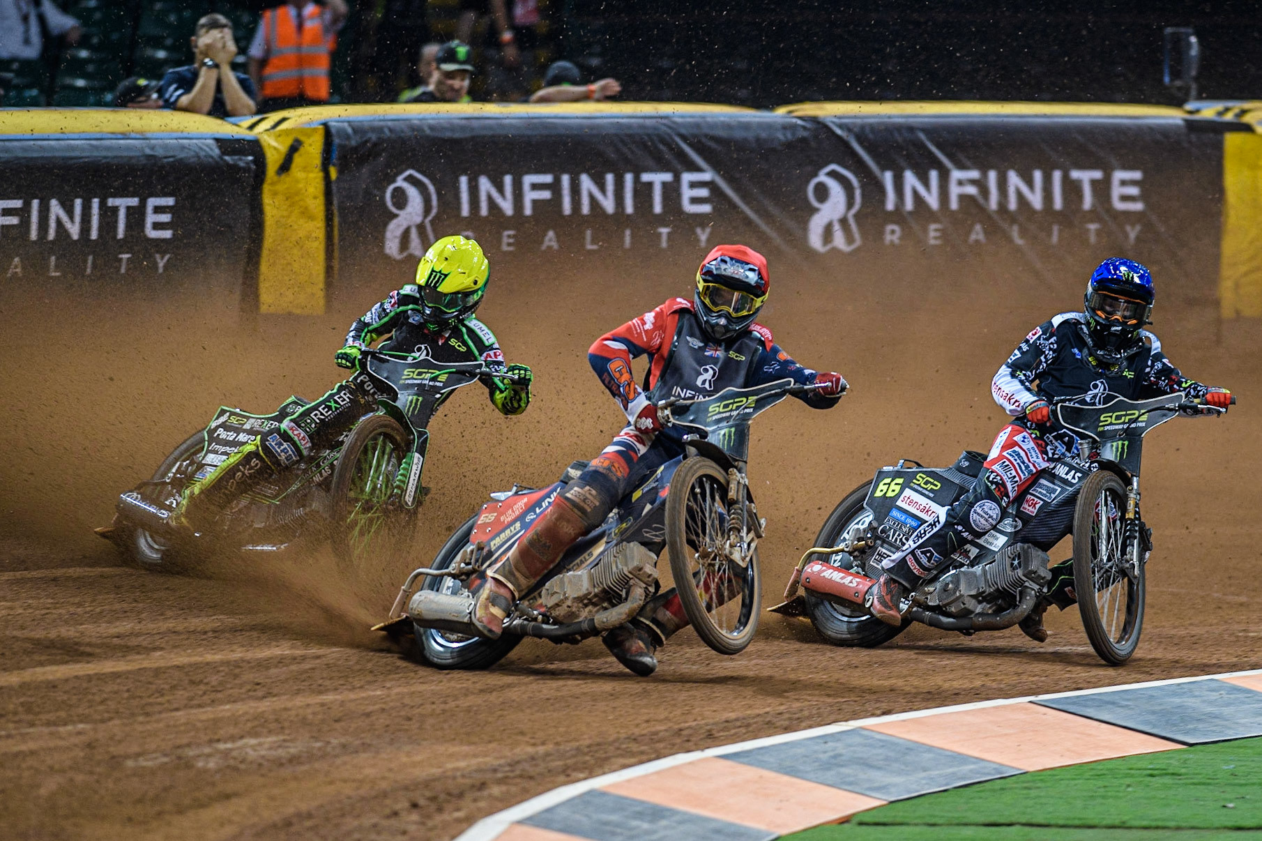 Steve Worrall (16) (Red) picks up some drive ahead of Freddie Lindgren (66) (Blue) and Patryk Dudek (692) (Yellow) during the FIM Speedway Grand Prix of Great Britain at the Principality Stadium, Cardiff on Saturday 2nd September 2023. (Photo: Ian Charles | MI News)