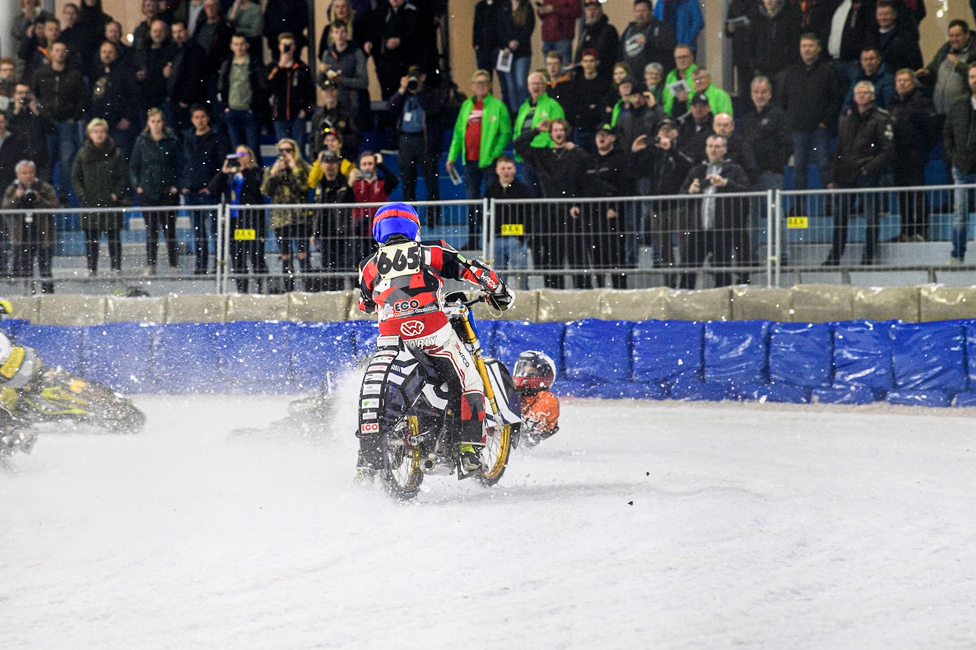 Finland's Aki Ala-Riihimäki (66) in White spins off leaving Austria's Charly Ebner (665) in Blue with nowhere to go during the FIM Ice Speedway Gladiators World Championship Final 4 at Ice Rink Thialf, Heerenveen on Sunday 7th April 2024. (Photo: Ian Charles | MI News)