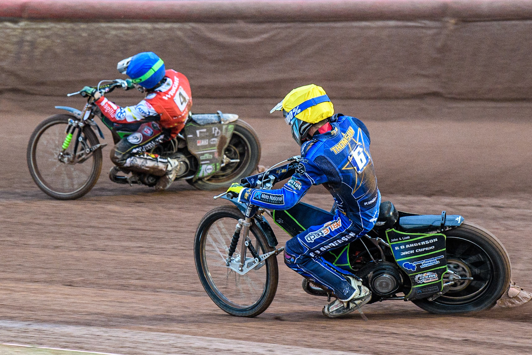 Kye Thomson (Yellow) chases Charles Wright (Blue) during the Sports Insure Premiership match between Belle Vue Aces and King's Lynn Stars at the National Speedway Stadium, Manchester on Monday 12th June 2023. (Photo: Ian Charles | MI News)