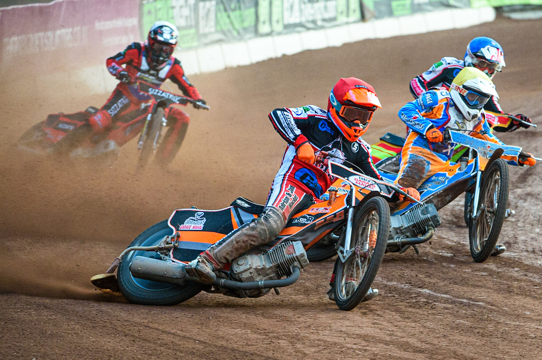 MANCHESTER, UK. JULY 23RD  Connor Coles  (Red) outside Danno Verge  (Yellow) and Ben Woodhull  (Blue) with Joe Alcock (White) behind during the National Development League match between Belle Vue Colts and Eastbourne Seagulls at the National Speedway Stadium, Manchester on Friday 23rd July 2021. (Credit: Ian Charles | MI News)