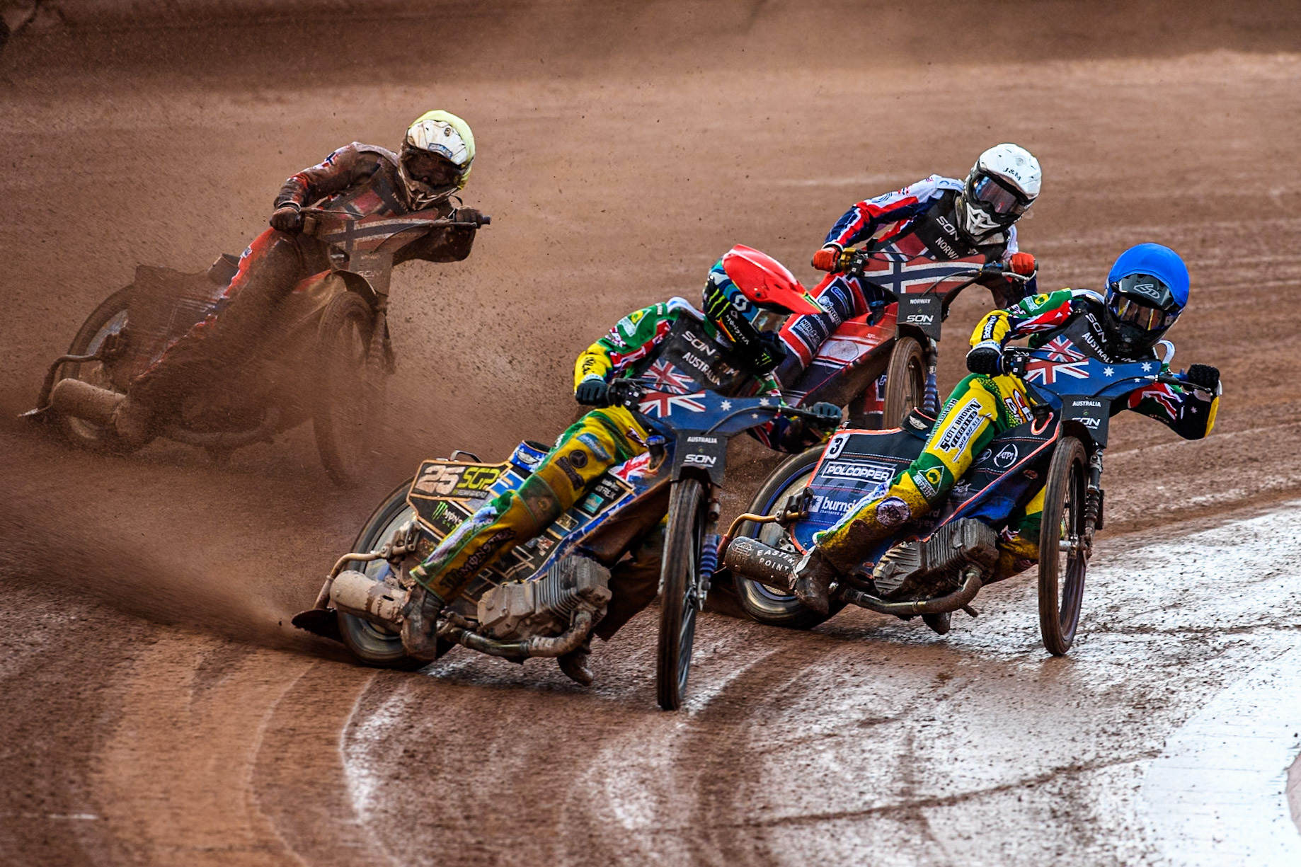 Australia v Norway: Jack Holder of Australia in Red rides outside team mate Brady Kurtz of Australia in Blue with Mathias Pollestad of Norway in White and Truls Kamhaug of Norway in Yellow behind during the Monster Energy FIM Speedway of Nation Semi Final 2 at the National Speedway Stadium, Manchester on Wednesday 10th July 2024. (Photo: Ian Charles | MI News)