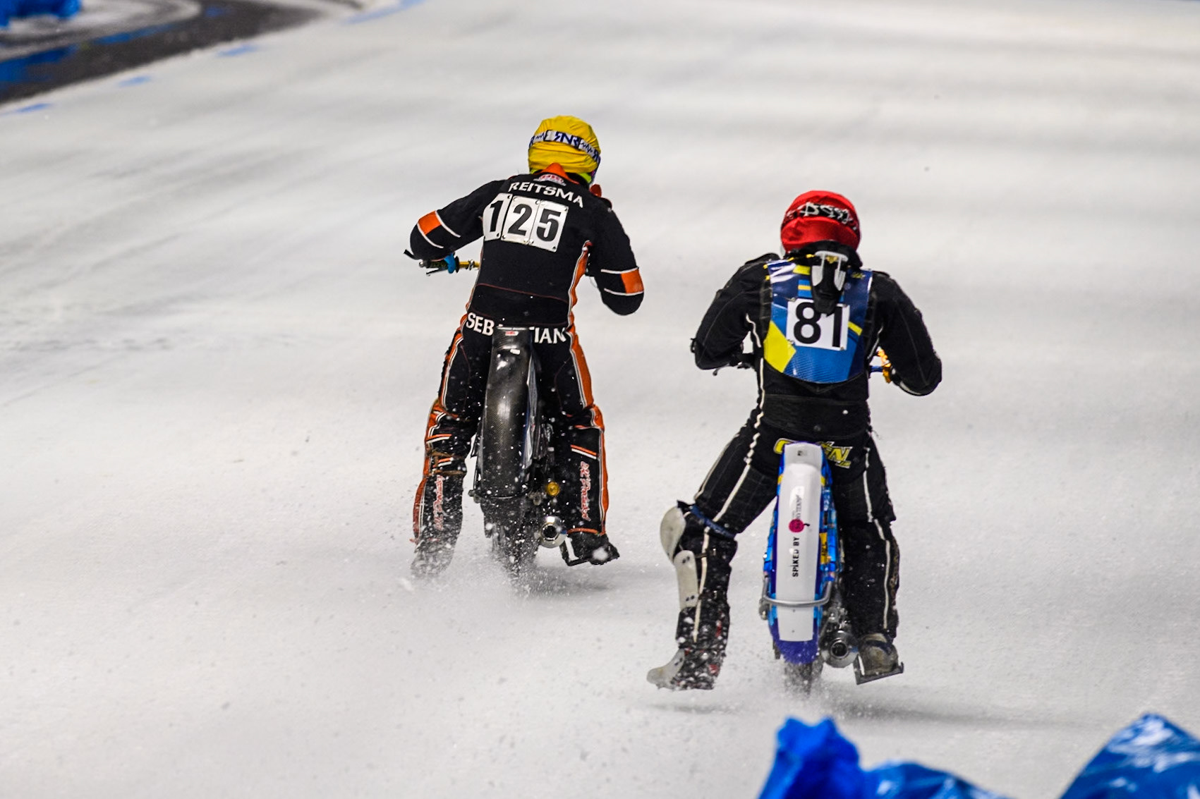 Sebastian Reitsma (125) of The Netherlands in Yellow passes Jimmy Olsén (81) of Sweden in Red during the Ice Speedway Gladiators World Championship Final 1 at Max-Aicher-Arena, Inzell on Saturday 15th March 2025. (Photo: Ian Charles | MI News)